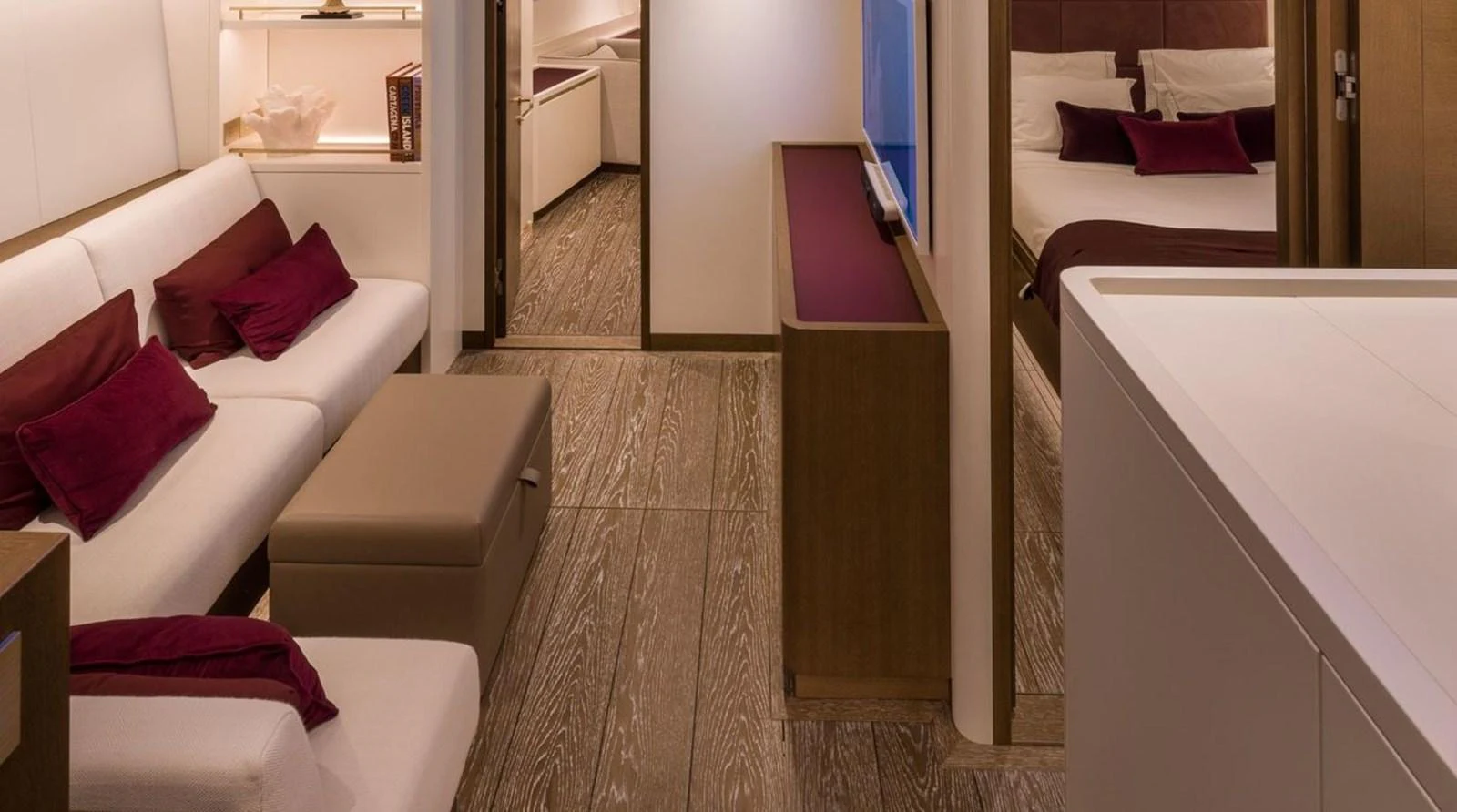 The yacht's salon features elegant seating with plush cushions and a warm, inviting ambiance. aboard FANCY Yacht for Sale