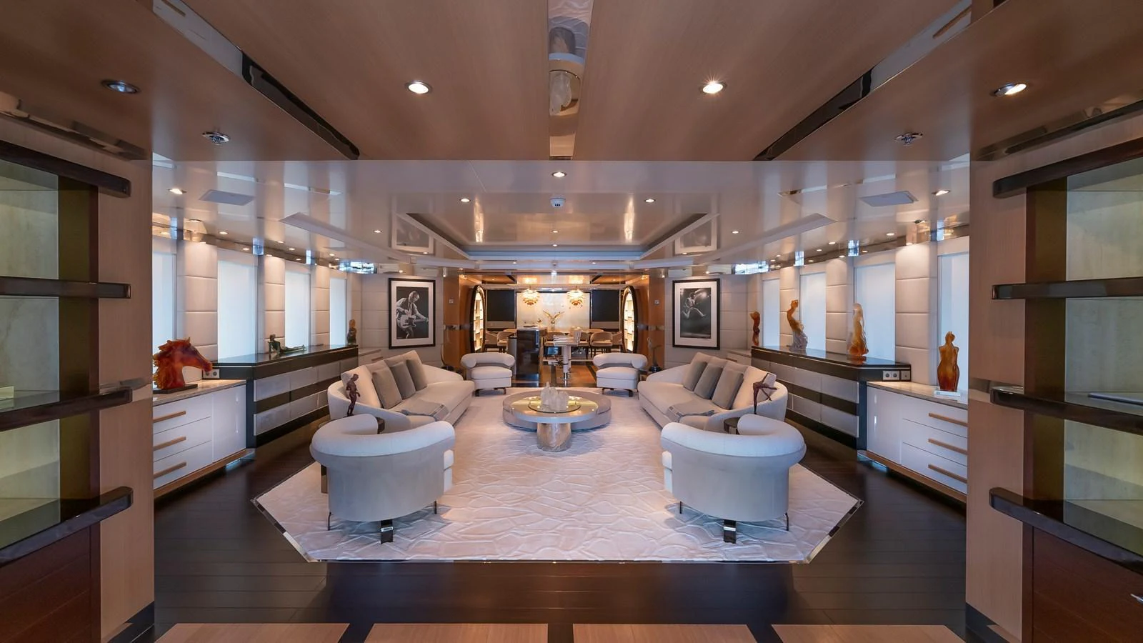 The yacht's salon features luxurious seating arrangements and elegant decor, creating a sophisticated and inviting atmosphere. aboard SCOTT FREE Yacht for Sale