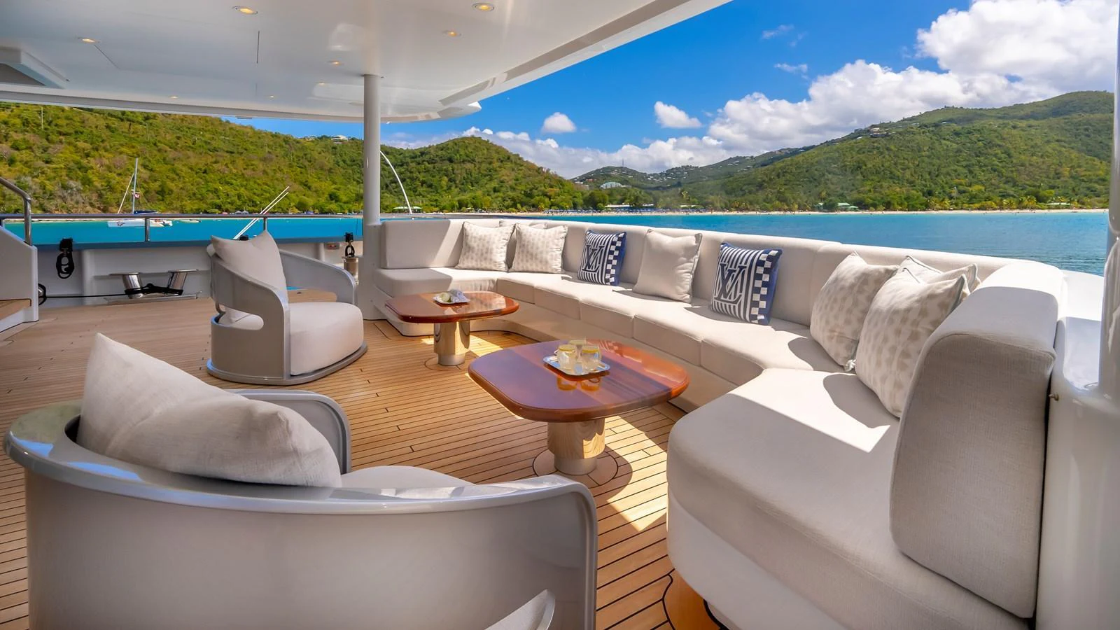 The aft deck features luxurious seating with stunning views of the surrounding waters and landscape. aboard SCOTT FREE Yacht for Sale