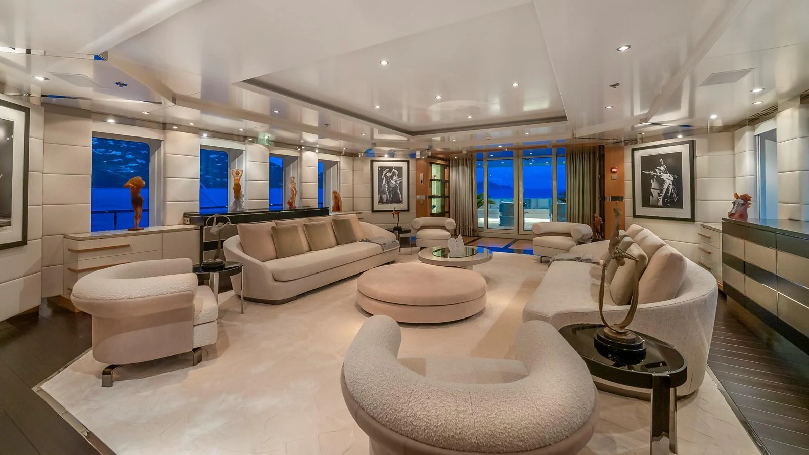 The yacht's salon offers a spacious and luxurious seating area with elegant decor and large windows providing stunning ocean views. aboard SCOTT FREE Yacht for Sale
