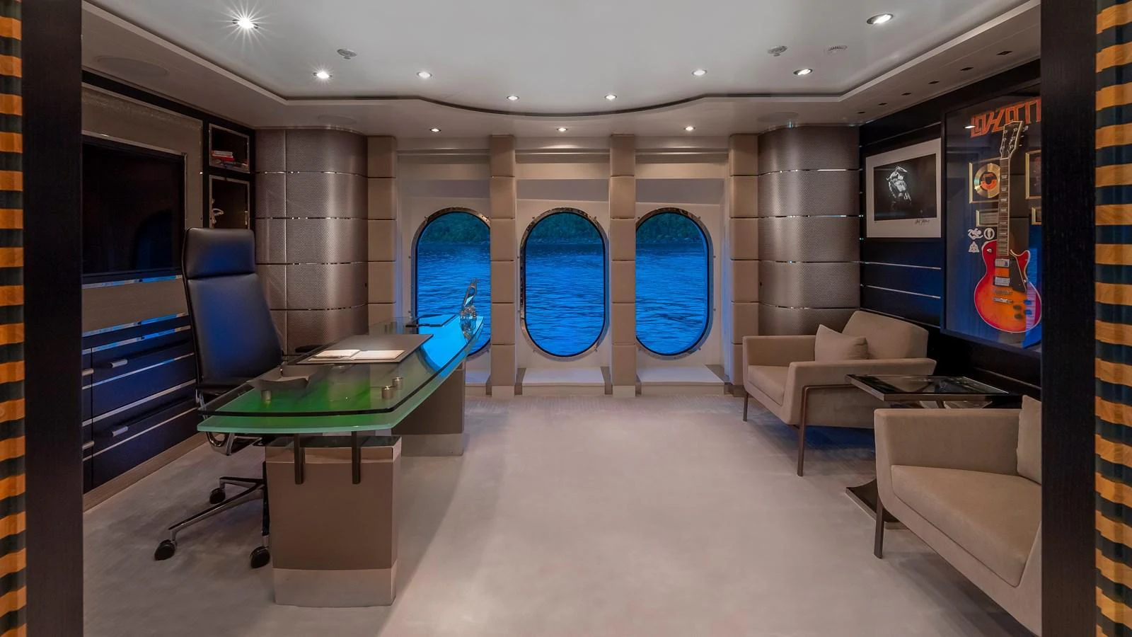 A luxurious yacht office with a modern design and large windows offering a stunning ocean view. aboard SCOTT FREE Yacht for Sale