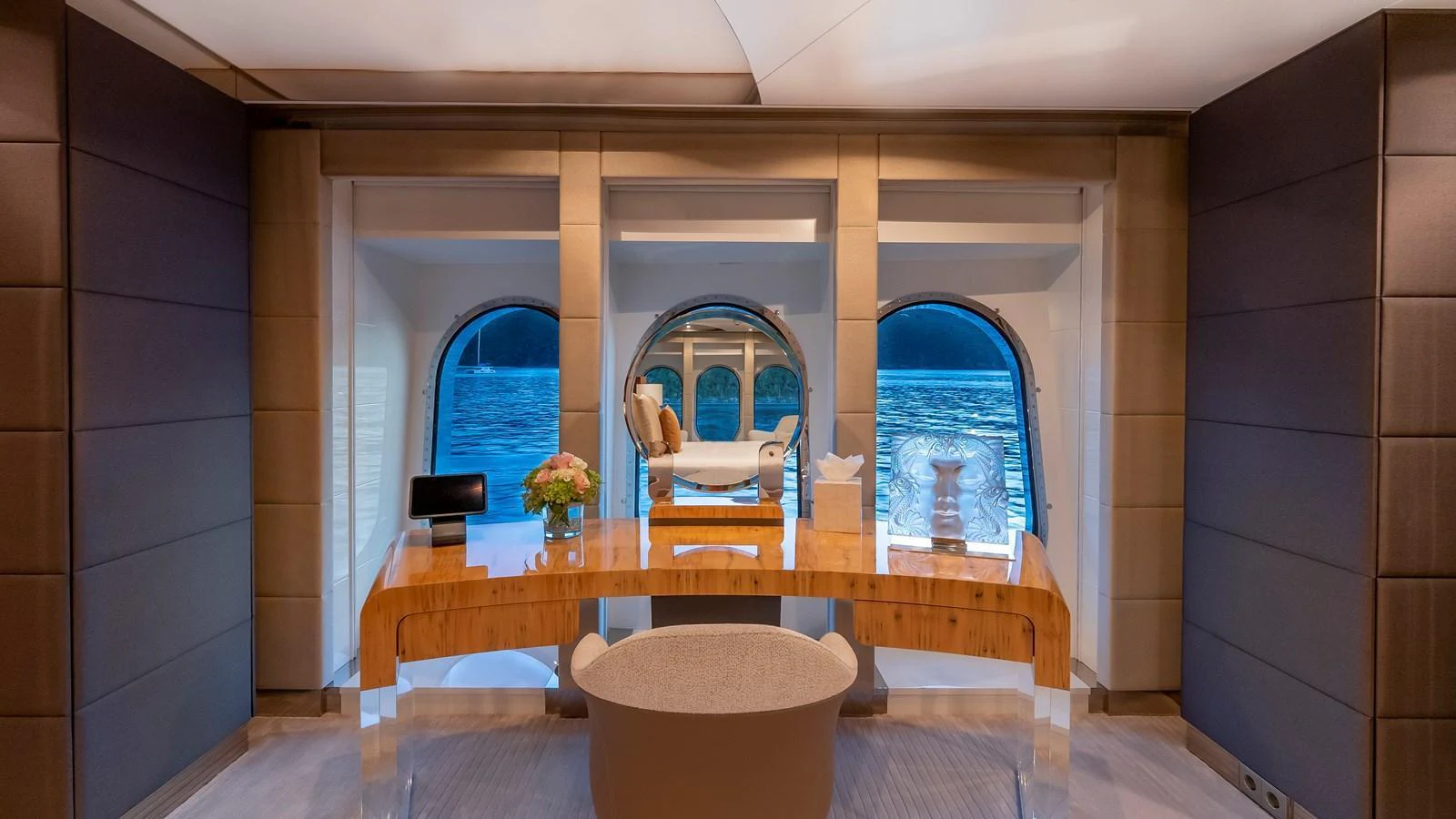 A luxurious yacht office with a stunning ocean view through large windows. aboard SCOTT FREE Yacht for Sale