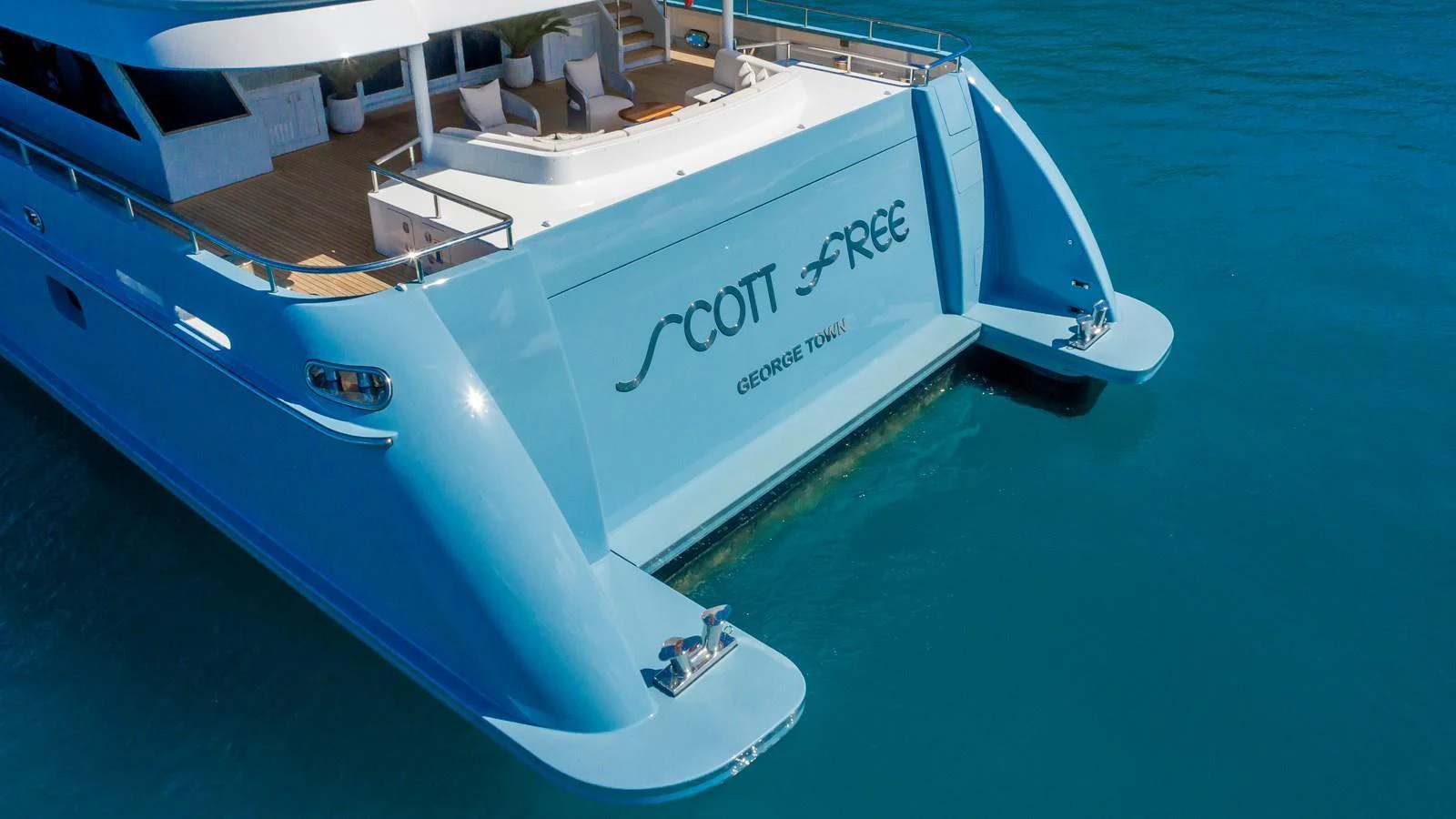 The yacht's aft deck is showcased with a sleek design and elegant detailing. aboard SCOTT FREE Yacht for Sale