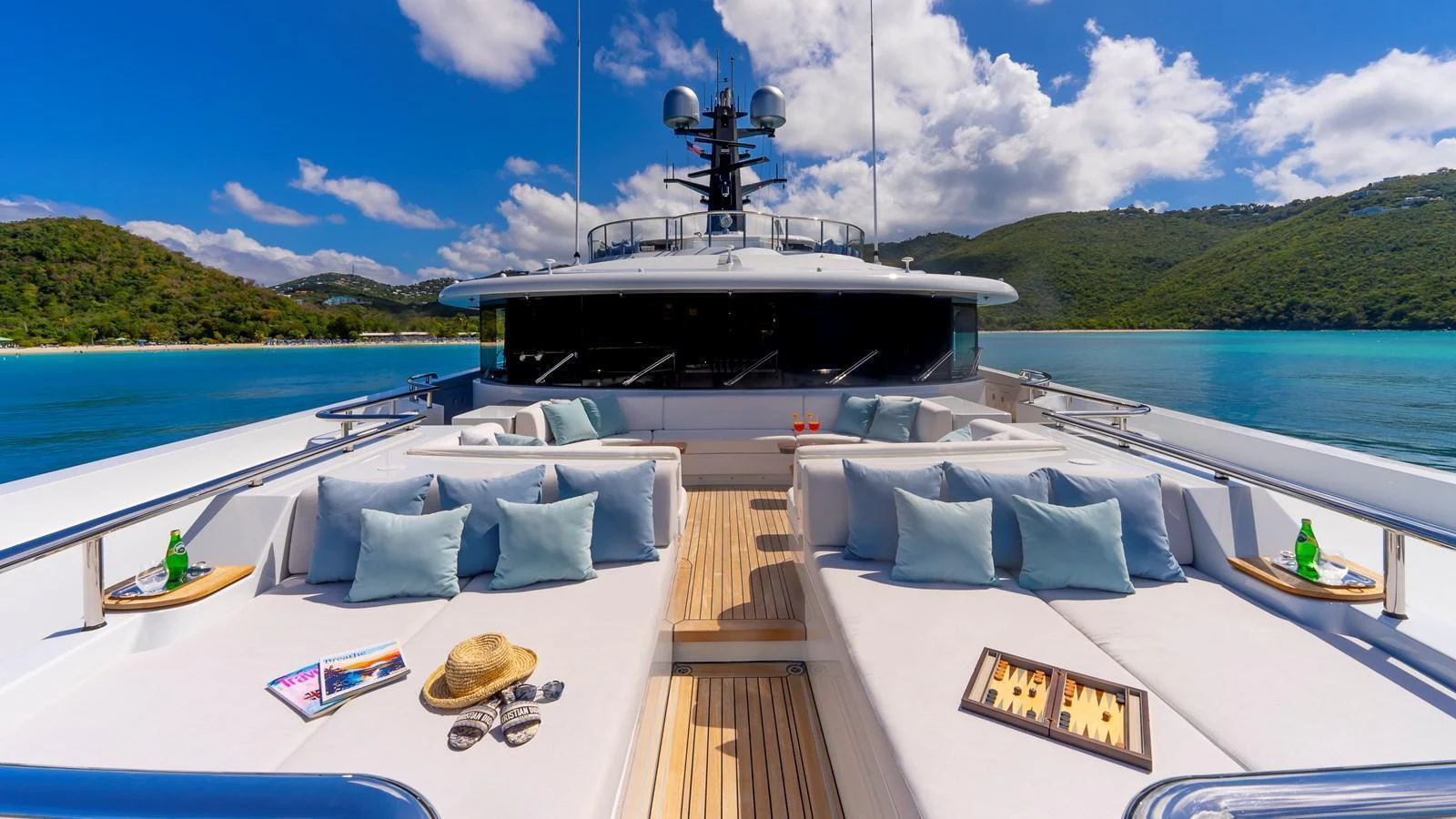 The sundeck offers a luxurious lounging area with plush seating and scenic views. aboard SCOTT FREE Yacht for Sale