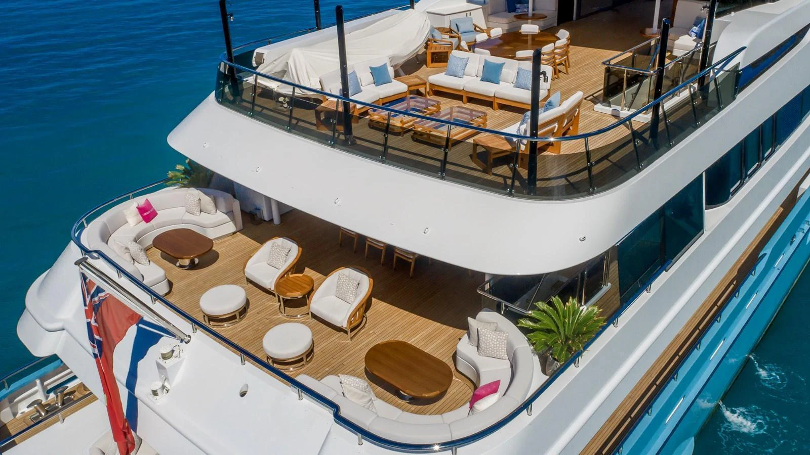 The yacht's sundeck offers luxurious lounging areas with ample seating and stunning views over the water. aboard SCOTT FREE Yacht for Sale