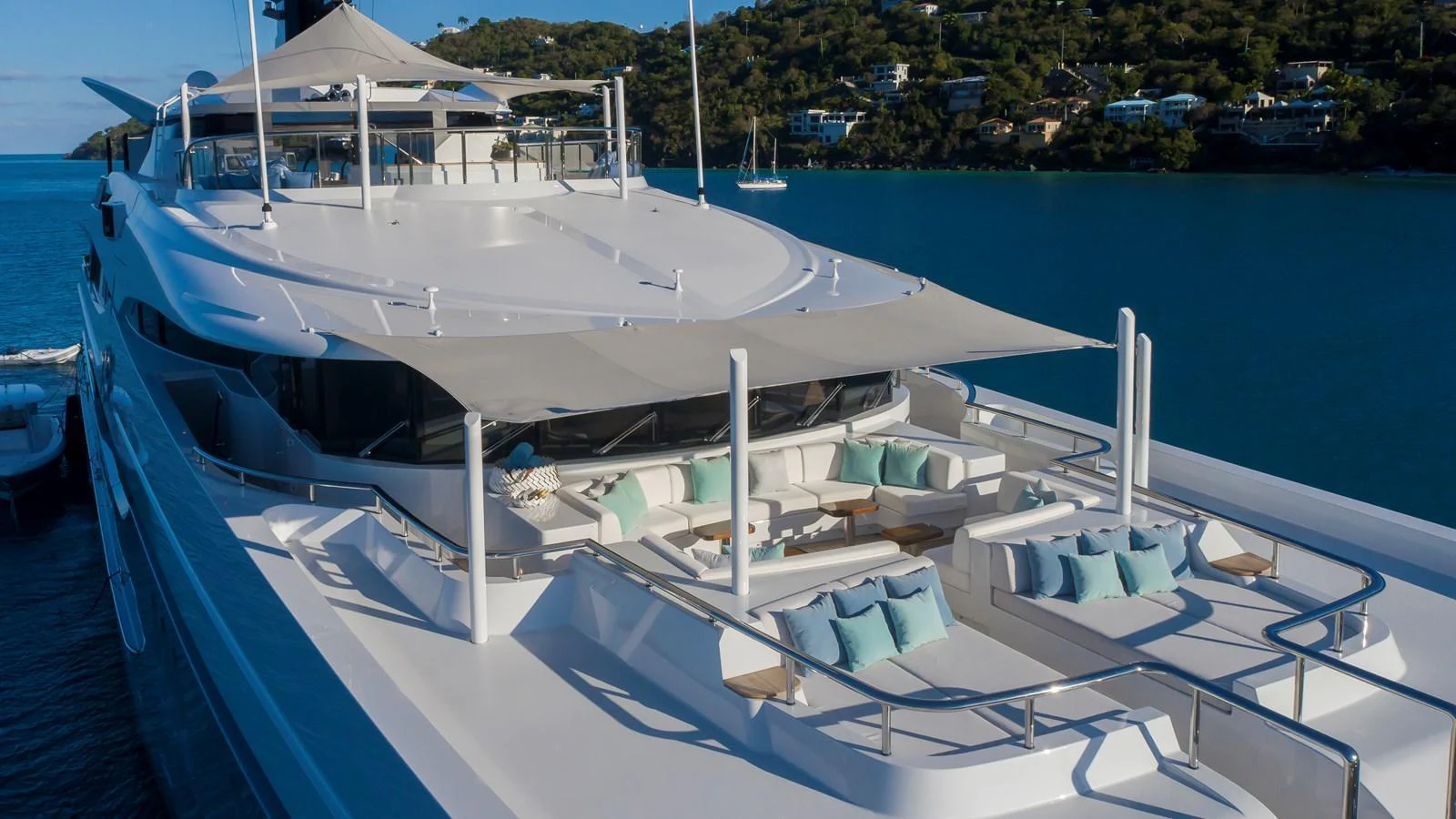 The yacht's sundeck offers luxurious lounging areas with plush seating and shade canopies, perfect for relaxation. aboard SCOTT FREE Yacht for Sale