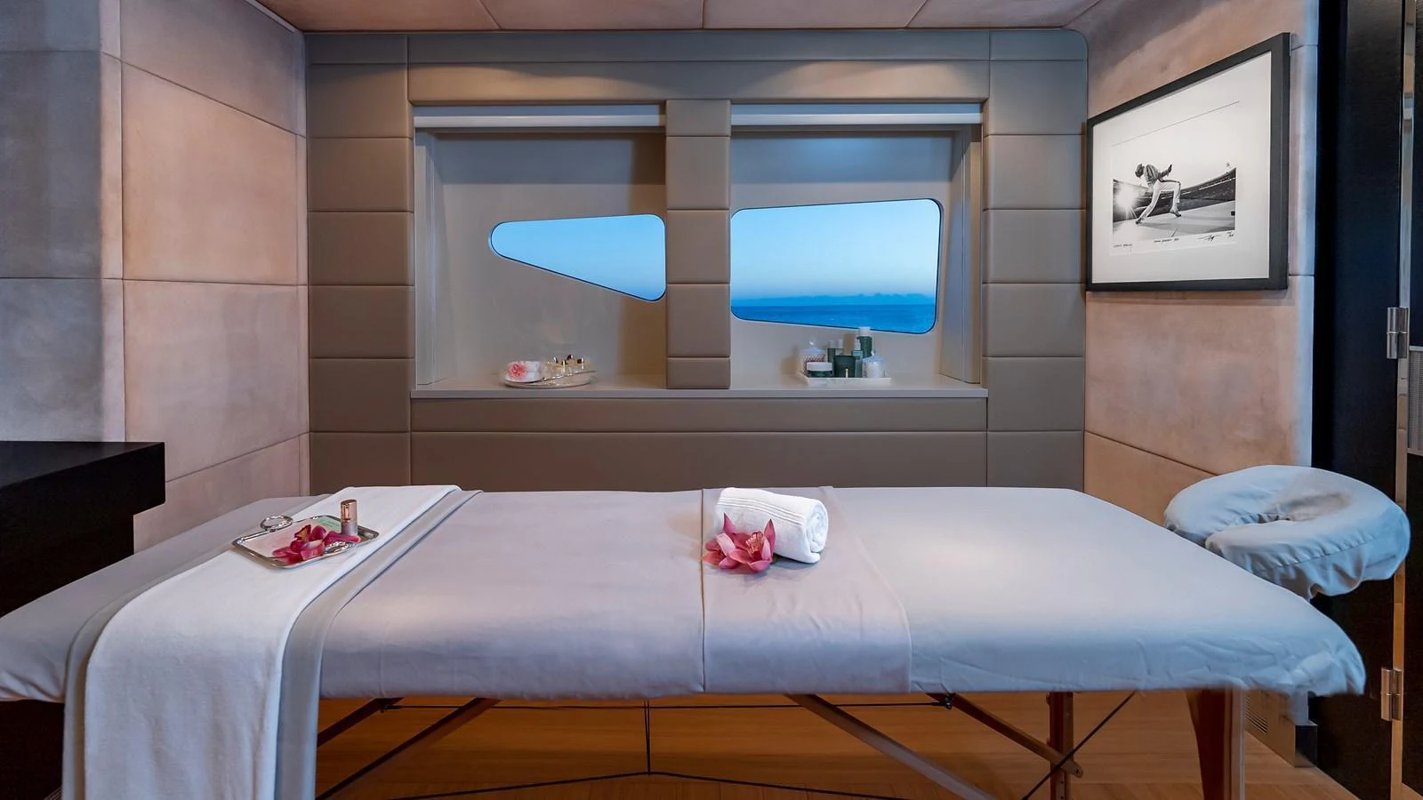 This serene spa room offers a tranquil space for relaxation and rejuvenation with a view of the sea. aboard SCOTT FREE Yacht for Sale