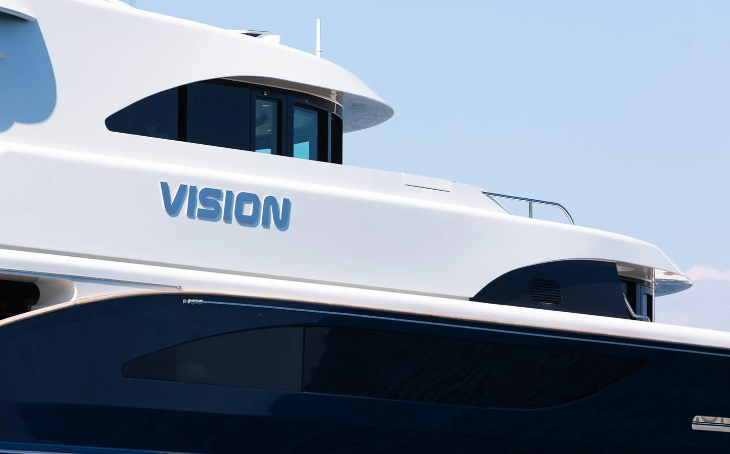 A sleek exterior profile of a yacht showcasing its modern design and elegant lines. aboard VISION Yacht for Sale