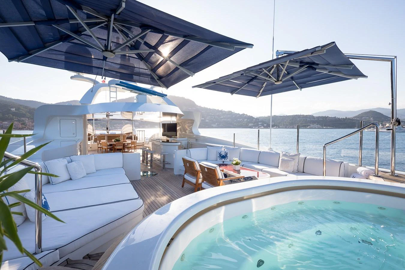 The sundeck features a luxurious jacuzzi, ample seating, and shaded areas for relaxation. aboard VISION Yacht for Sale