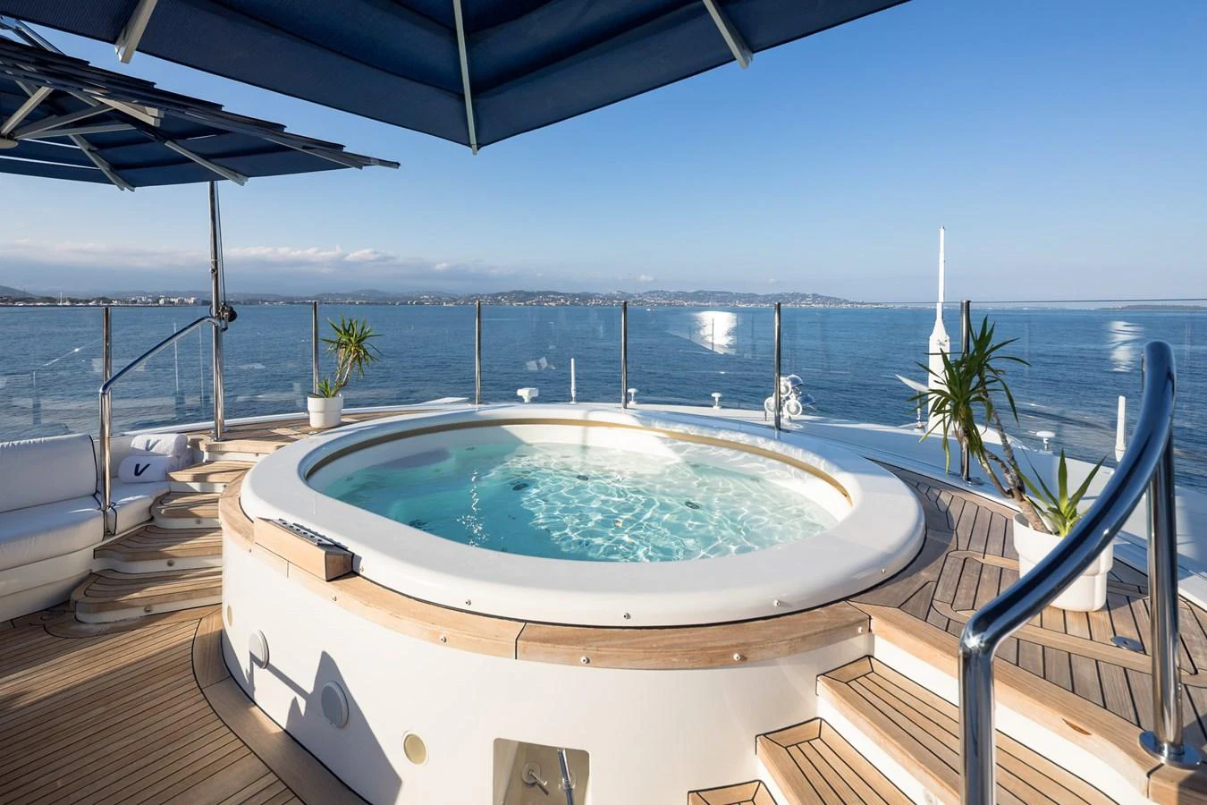 The sundeck features a luxurious jacuzzi with stunning ocean views. aboard VISION Yacht for Sale