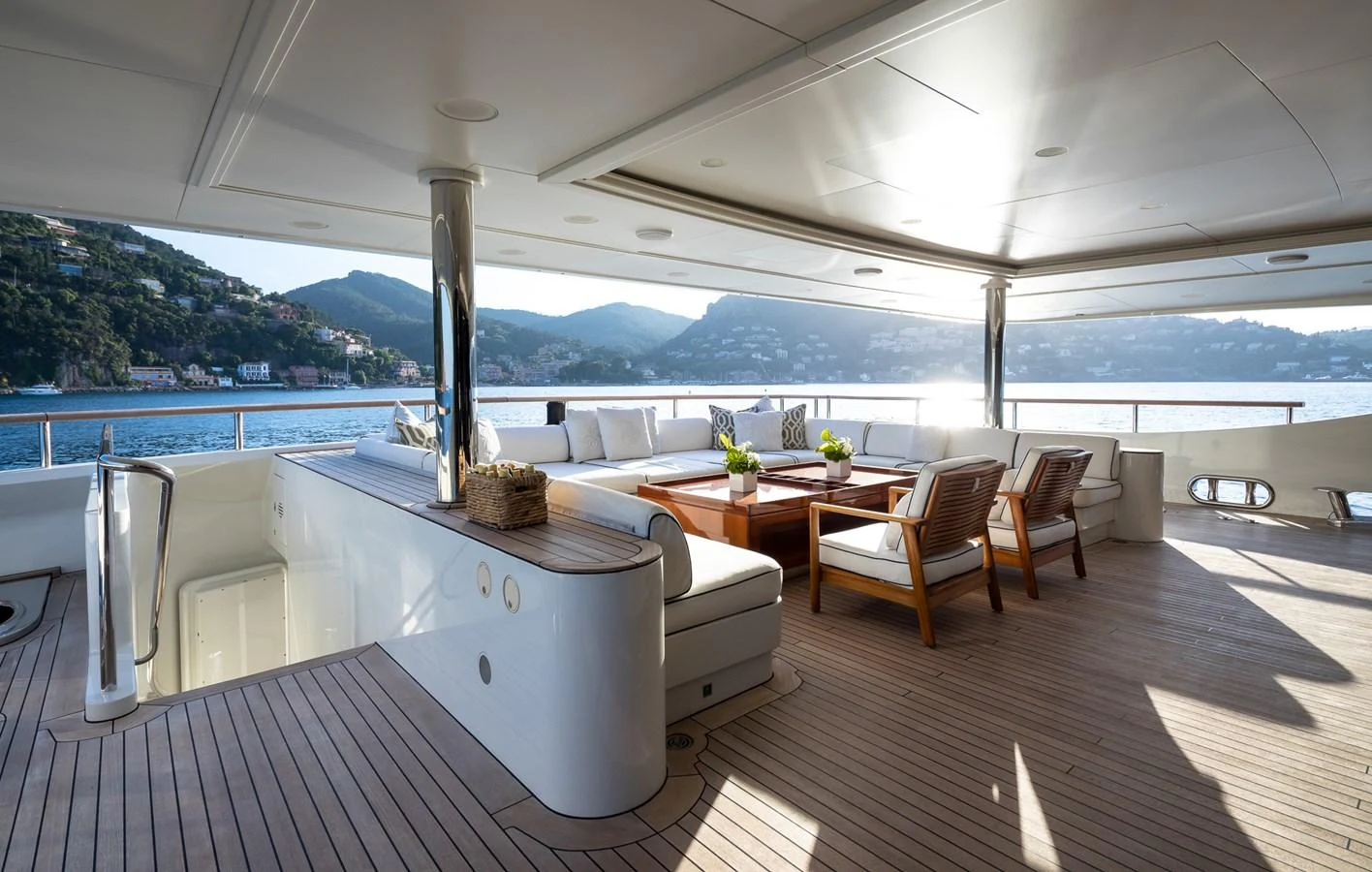 The aft deck offers a spacious and elegant outdoor seating area with stunning views of the surrounding waters. aboard VISION Yacht for Sale