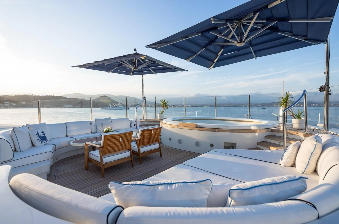 The sundeck features luxurious seating, a jacuzzi, and stunning views, perfect for relaxation and entertainment. aboard VISION Yacht for Sale