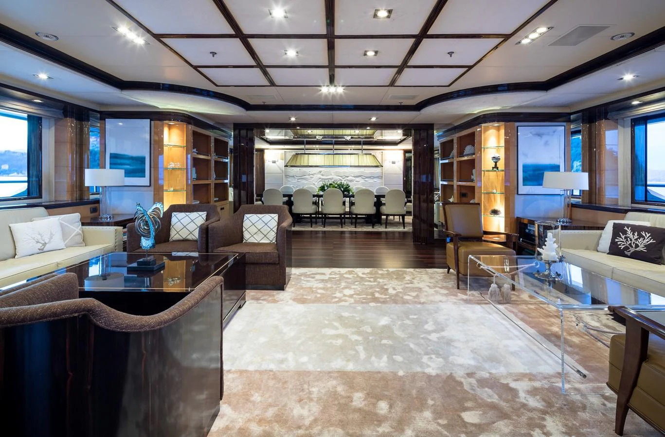 The spacious salon features elegant furnishings, ample seating, and large windows for natural light. aboard VISION Yacht for Sale