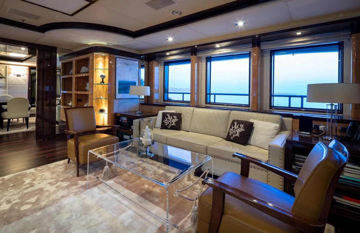 The yacht's salon features elegant seating, large windows, and tasteful decor, creating a luxurious and inviting atmosphere. aboard VISION Yacht for Sale