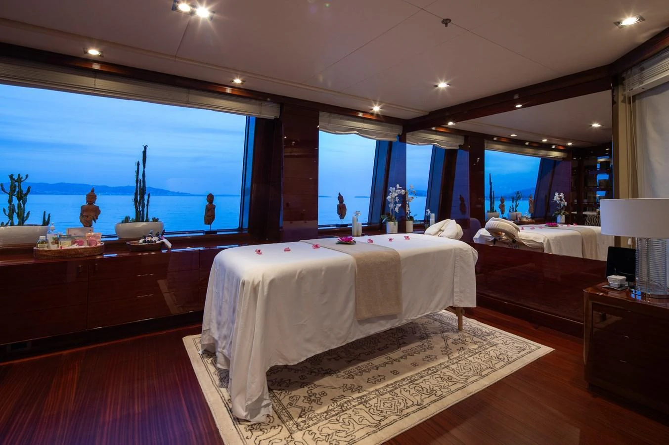 The yacht's serene spa room offers a tranquil space with panoramic ocean views. aboard VISION Yacht for Sale