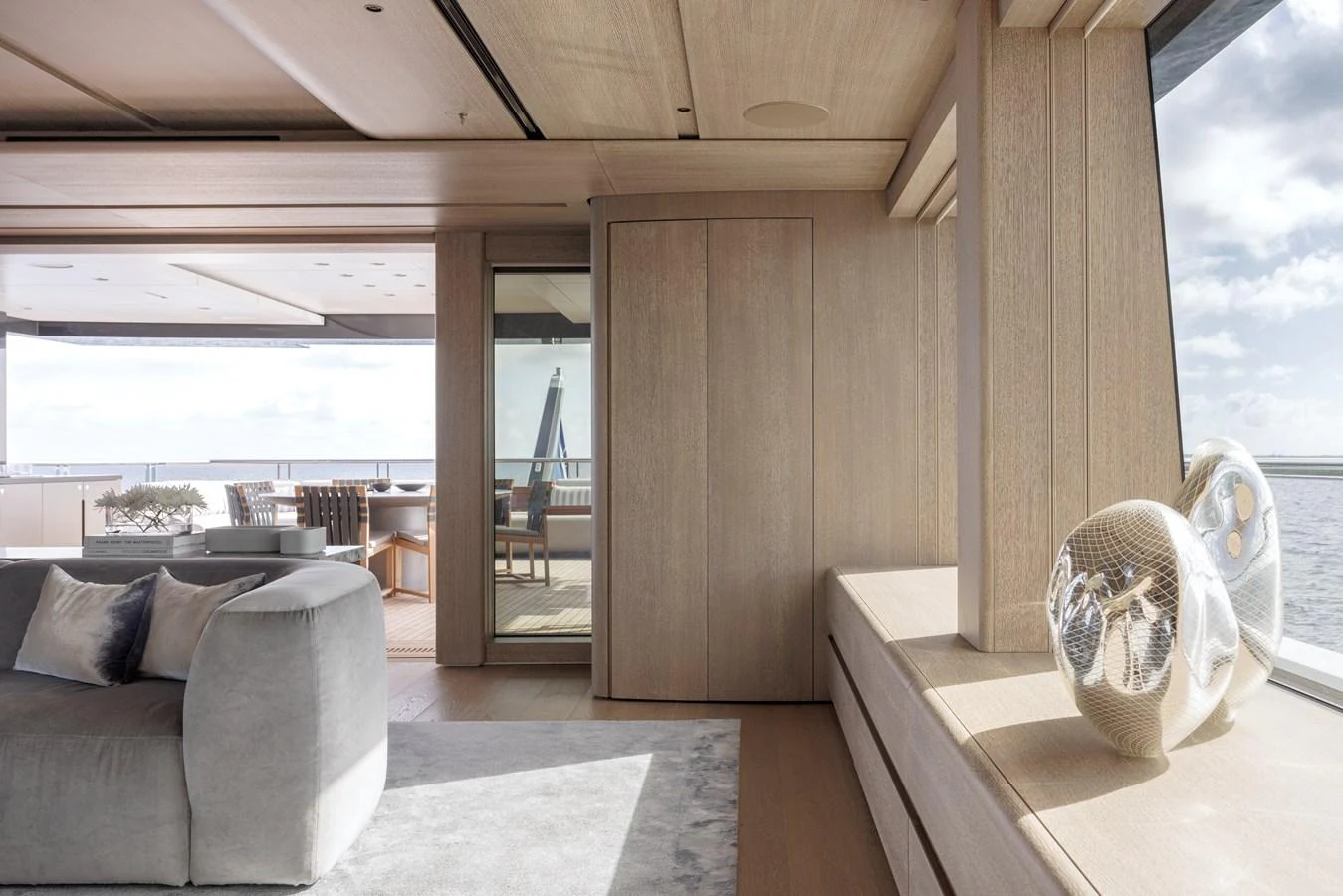The interior of the yacht features a modern and spacious design with large windows offering stunning sea views. aboard AMELS 60 Yacht for Sale
