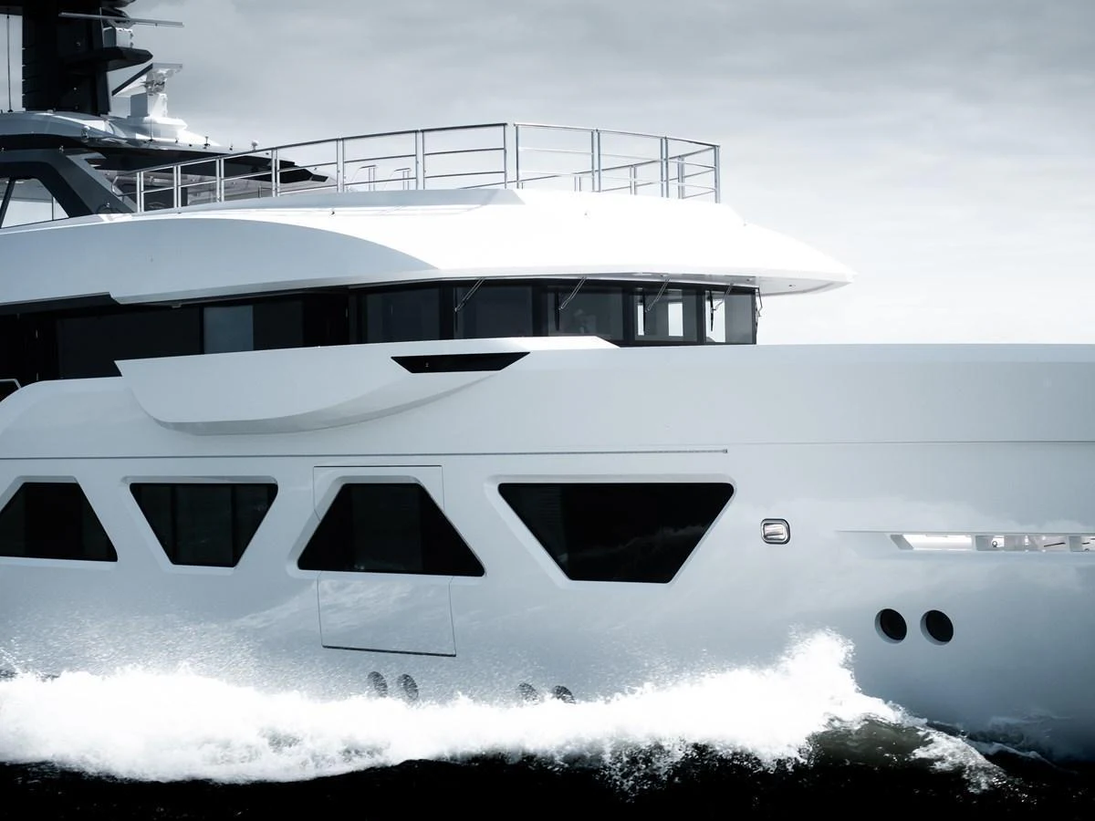 A sleek and modern yacht cruising through the water with elegant design lines. aboard AMELS 60 Yacht for Sale