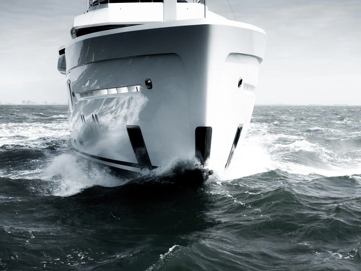 A powerful yacht cuts through the waves with its sleek bow design. aboard AMELS 60 Yacht for Sale