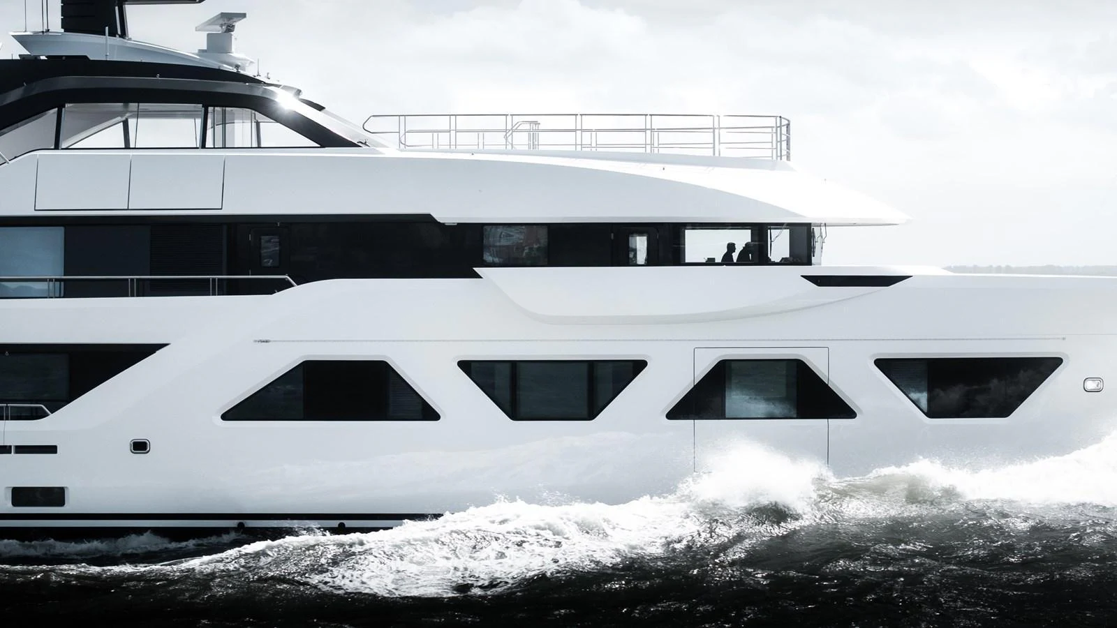 A sleek, modern yacht cruising through the water with a striking white hull and contemporary design. aboard AMELS 60 Yacht for Sale