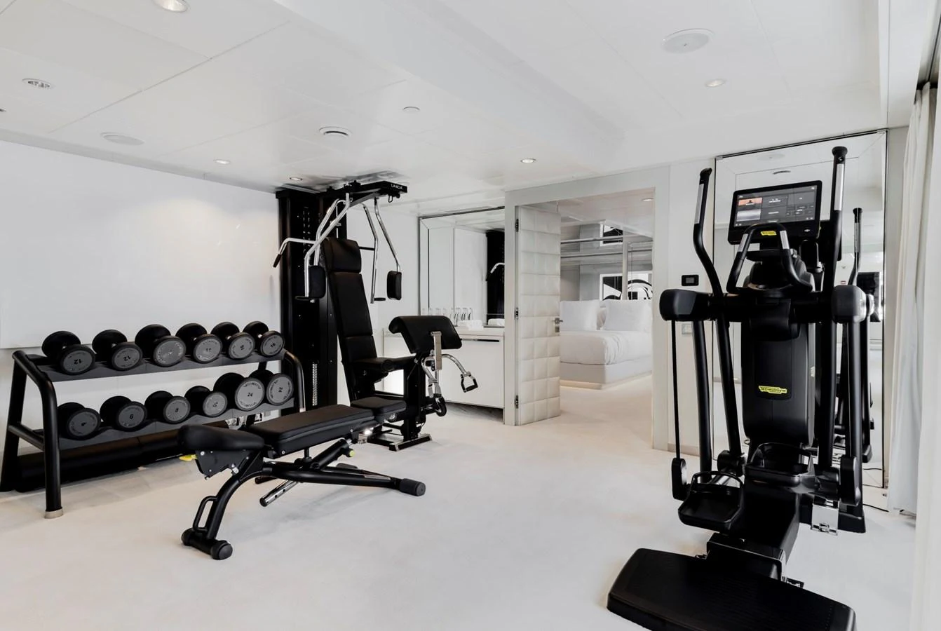 The yacht features a well-equipped gym with modern fitness equipment and free weights. aboard IDOL Yacht for Sale