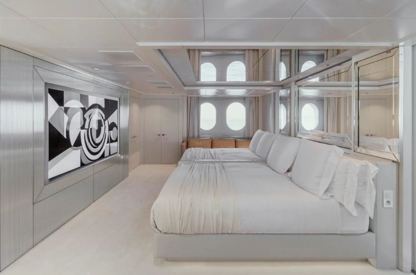 A luxurious stateroom featuring a large bed and modern decor. aboard IDOL Yacht for Sale
