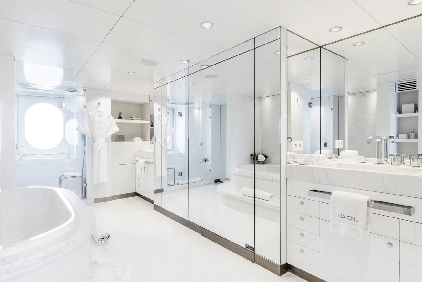 The yacht's bathroom features a luxurious and spacious design with modern fixtures and ample natural light. aboard IDOL Yacht for Sale
