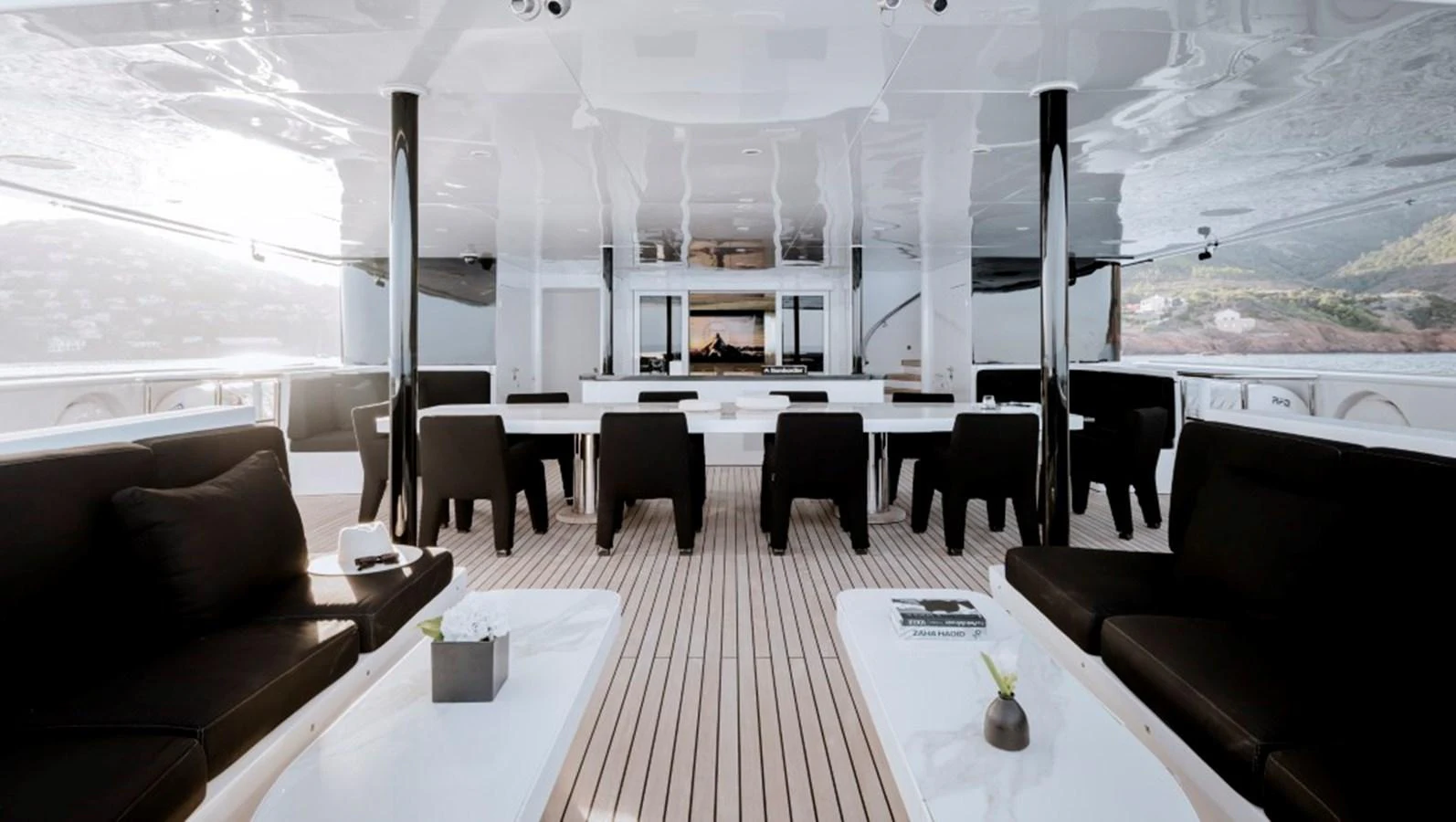The spacious salon features elegant seating and a modern, open layout with ample natural light. aboard IDOL Yacht for Sale