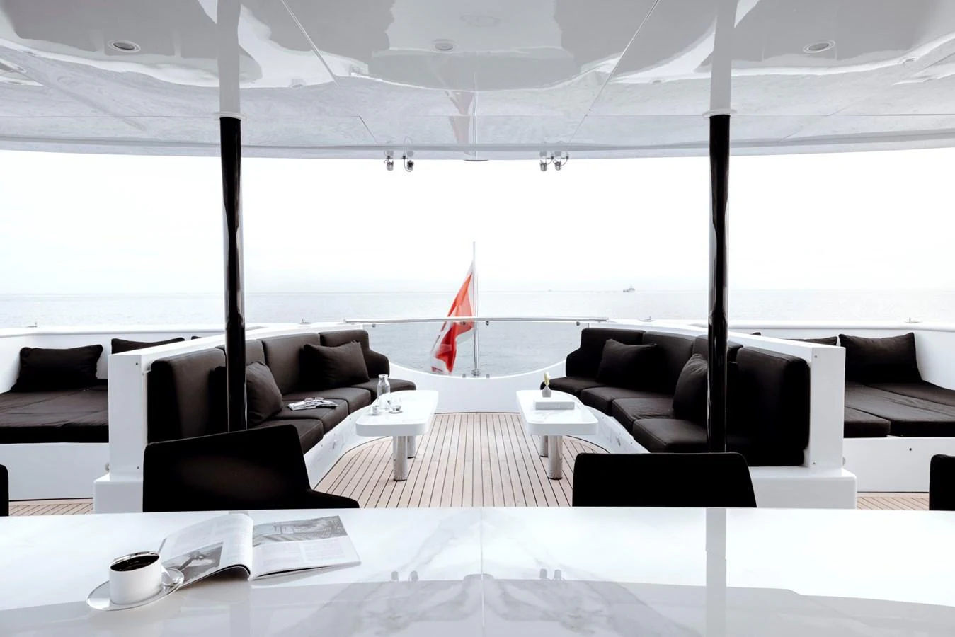 The aft deck features elegant seating with a panoramic ocean view. aboard IDOL Yacht for Sale