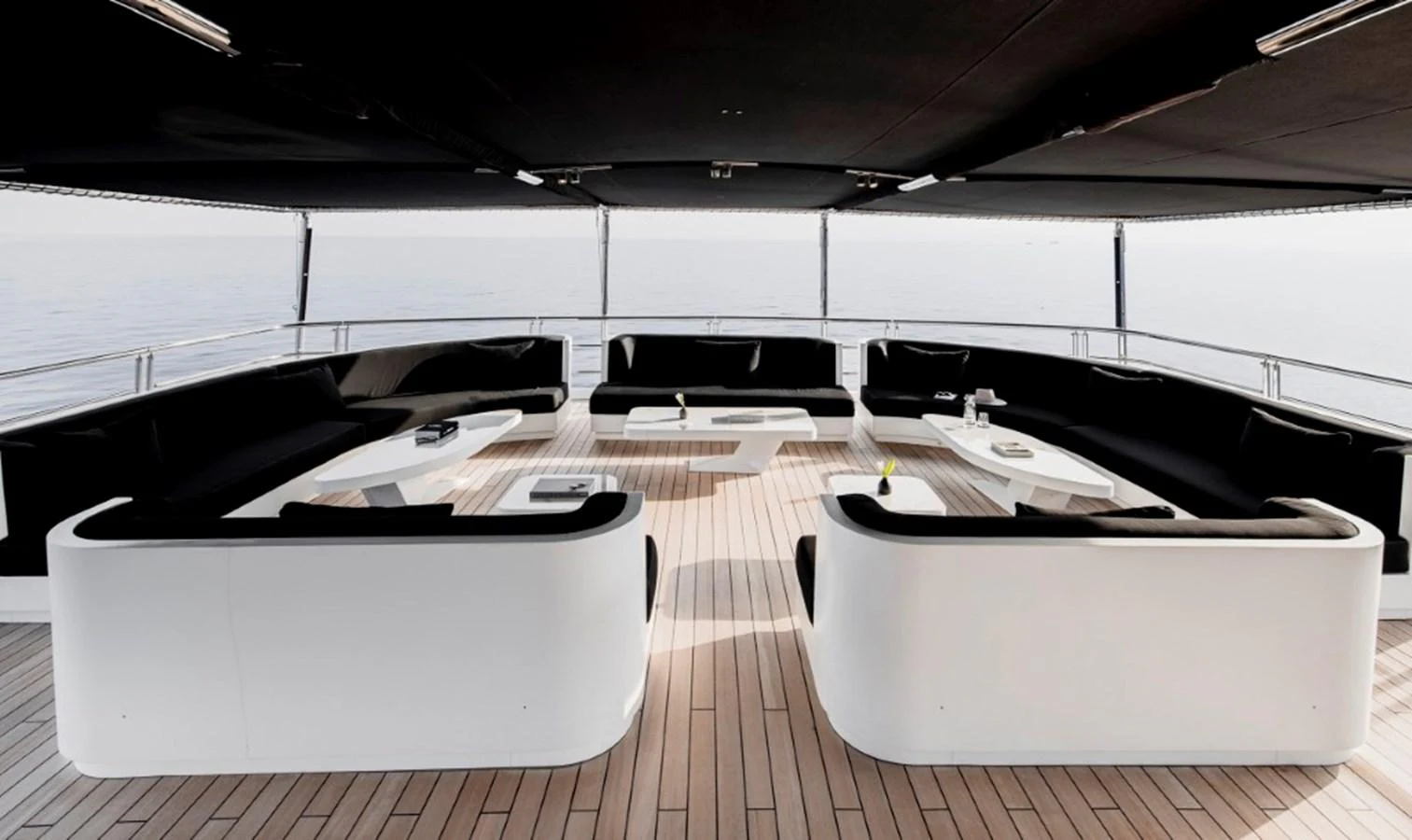 The sundeck features modern, stylish seating arrangements with a panoramic view of the sea. aboard IDOL Yacht for Sale