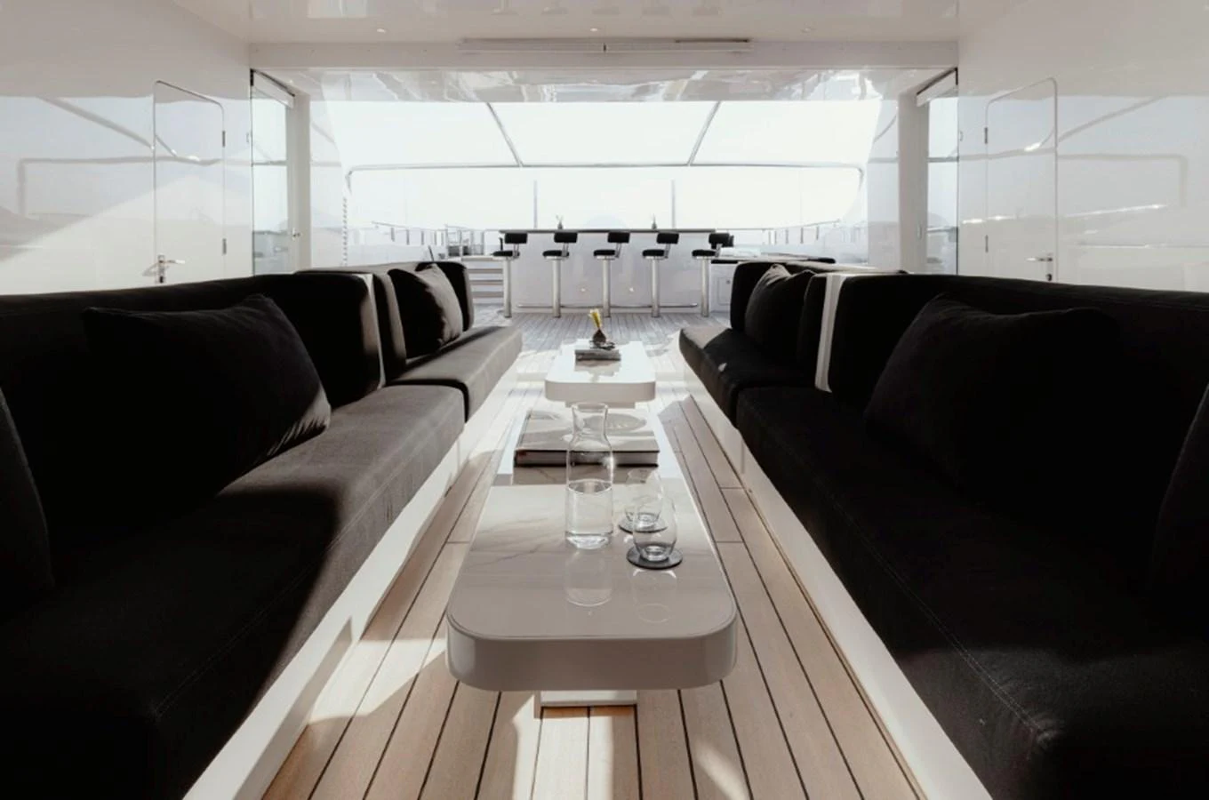 The yacht's salon features plush seating and a sleek, modern design with ample natural light. aboard IDOL Yacht for Sale