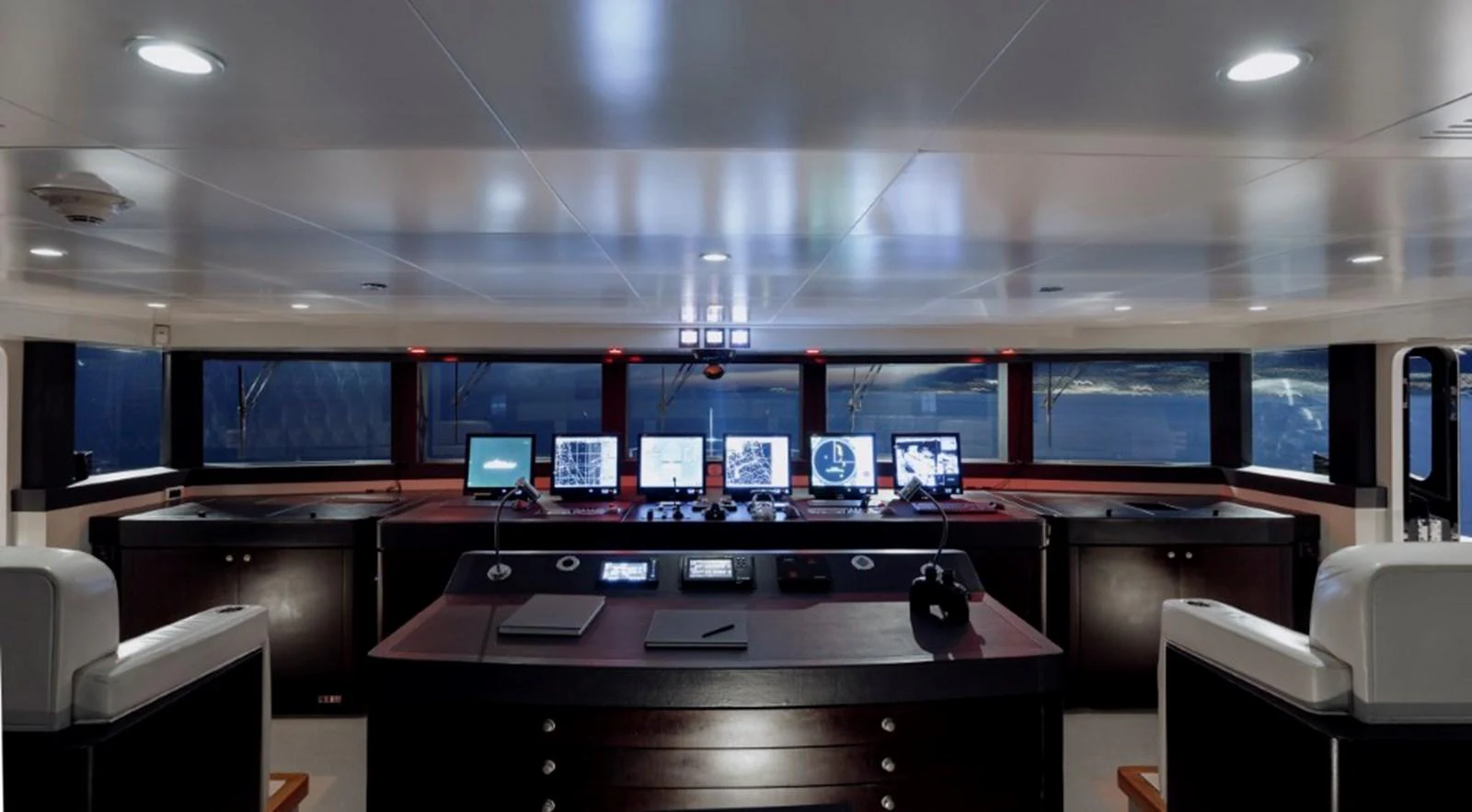 The helm station features advanced navigation equipment and a sleek, modern design. aboard IDOL Yacht for Sale