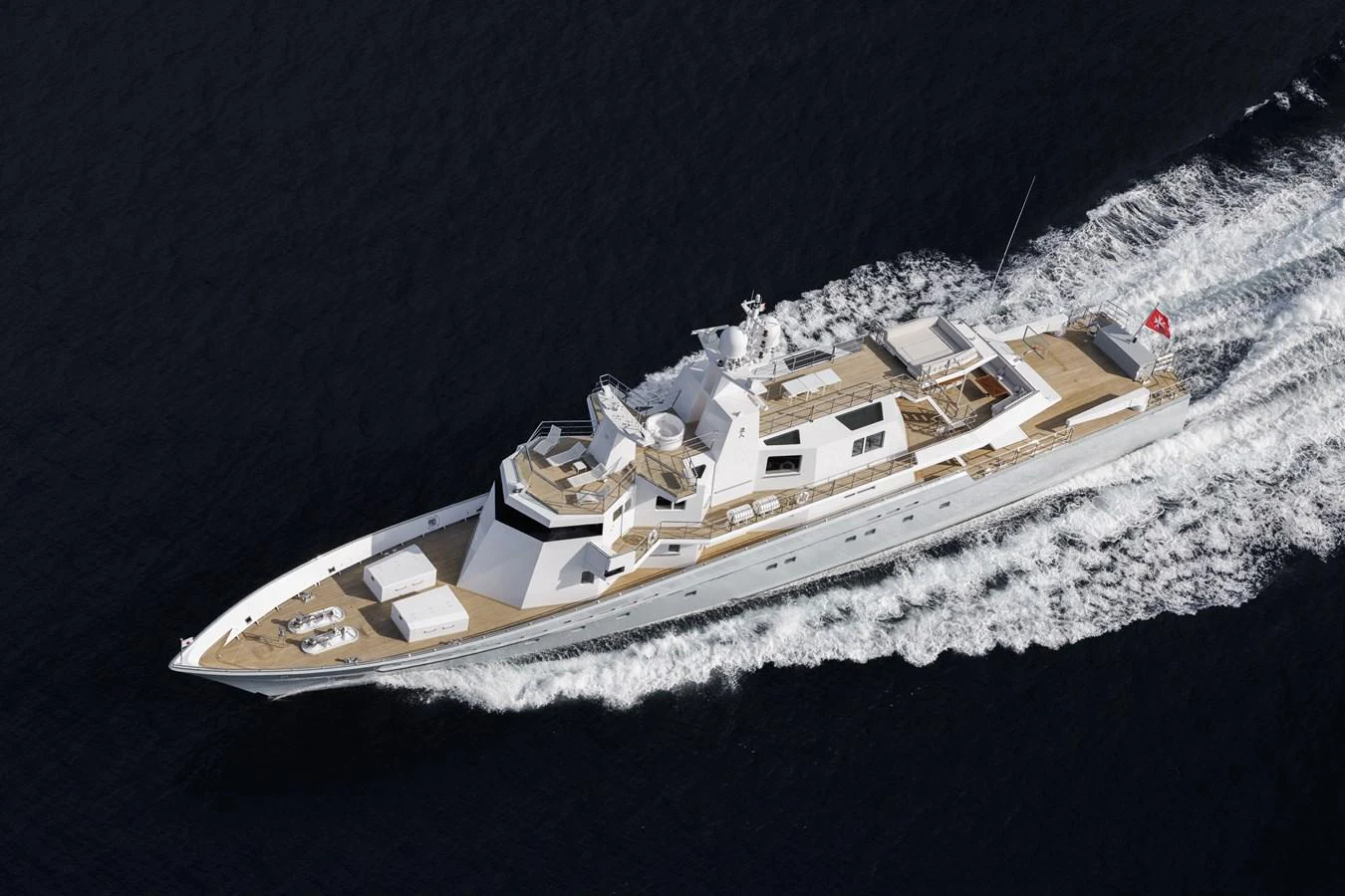 A sleek and elegant yacht glides smoothly through the water, showcasing its luxurious design and spacious deck areas. aboard RONIN Yacht for Sale