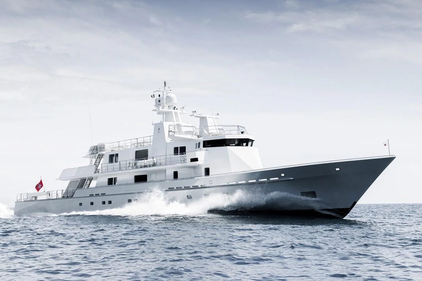 A sleek and modern yacht cruises swiftly through the open water. aboard RONIN Yacht for Sale
