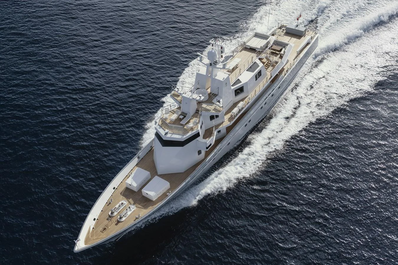 A sleek yacht glides swiftly through the water, showcasing its elegant design and spacious decks. aboard RONIN Yacht for Sale
