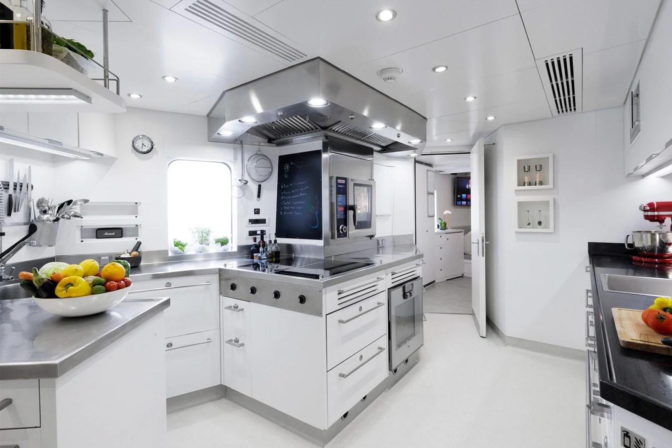 The yacht's galley is equipped with modern appliances and ample counter space, creating a bright and functional culinary environment. aboard RONIN Yacht for Sale