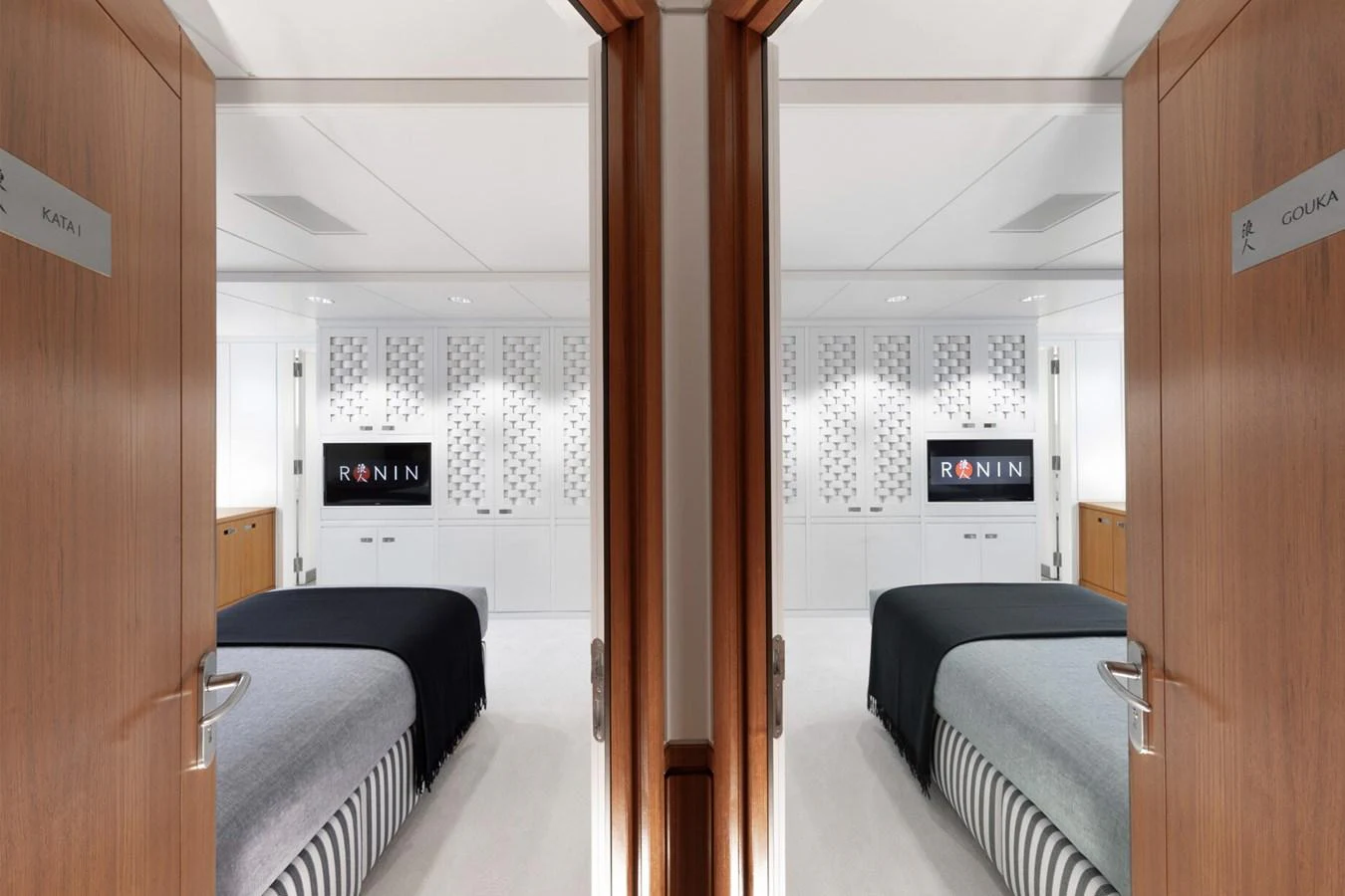 A luxurious stateroom with modern decor and a comfortable bed. aboard RONIN Yacht for Sale