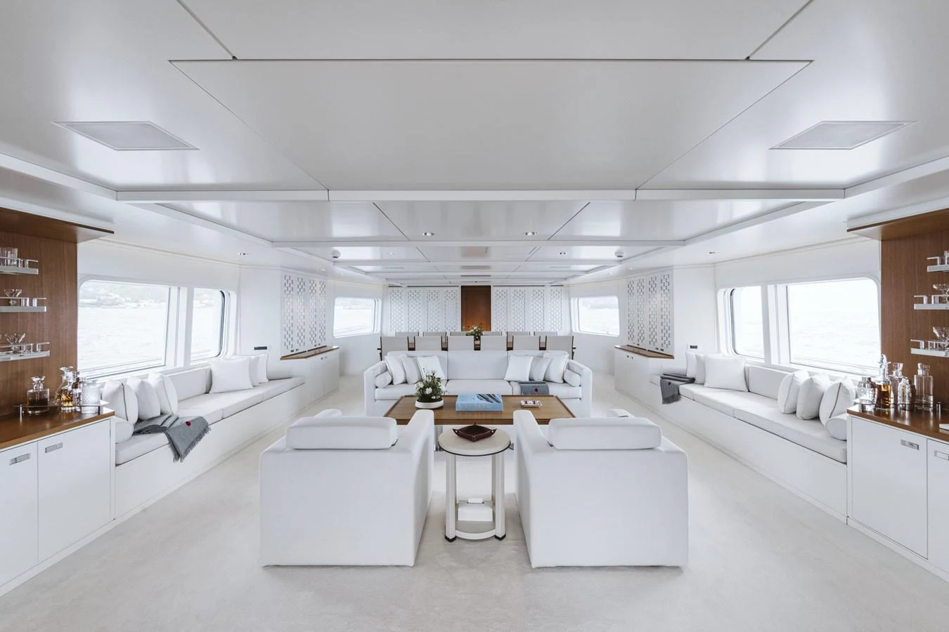 The yacht's salon features a spacious and elegantly designed seating area with panoramic windows. aboard RONIN Yacht for Sale