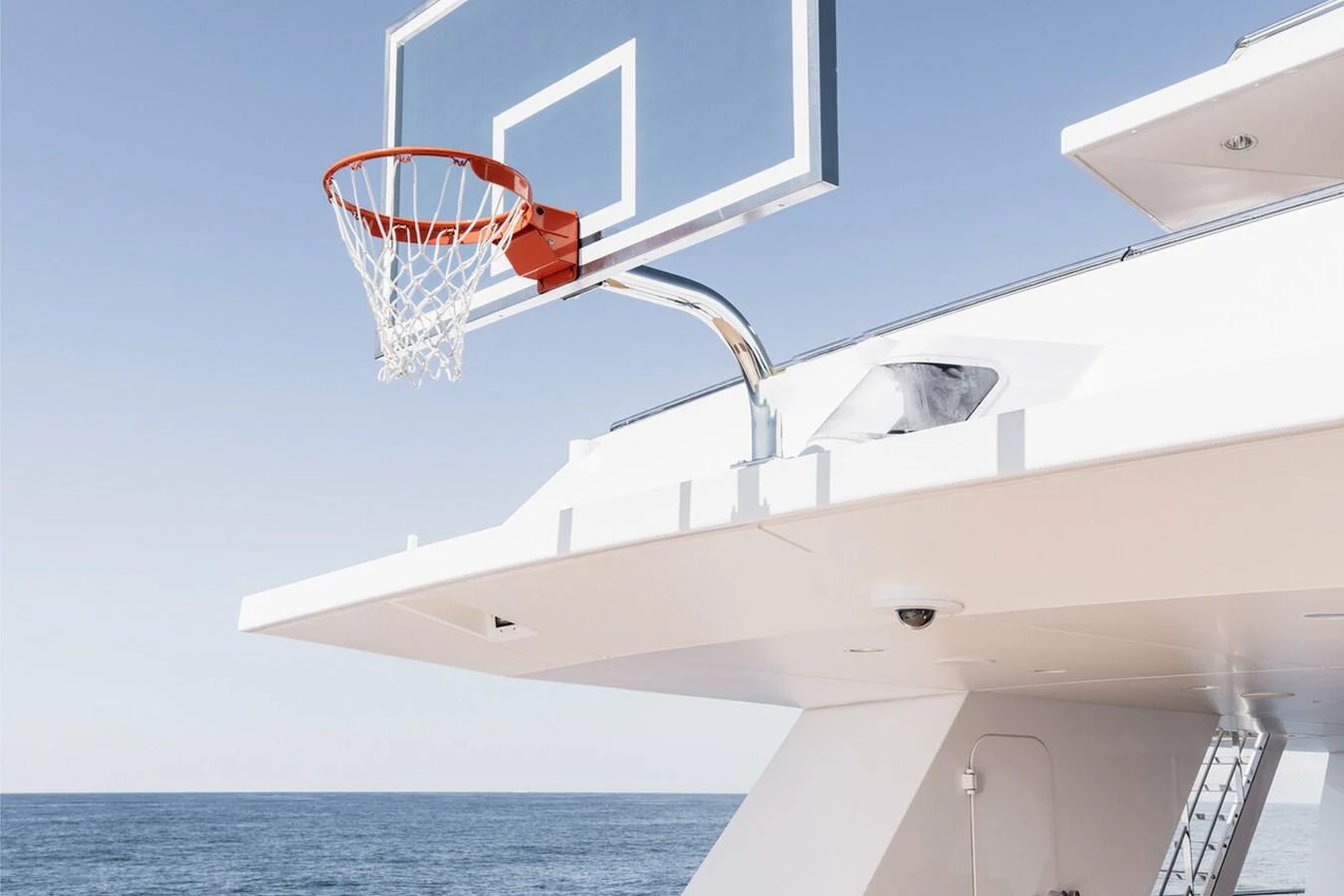 A yacht features a basketball hoop on its deck, offering recreational activities at sea. aboard RONIN Yacht for Sale