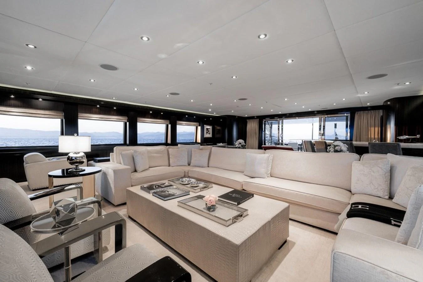 The spacious salon features elegant seating and panoramic windows, creating a luxurious and inviting atmosphere. aboard CARPE DIEM Yacht for Sale