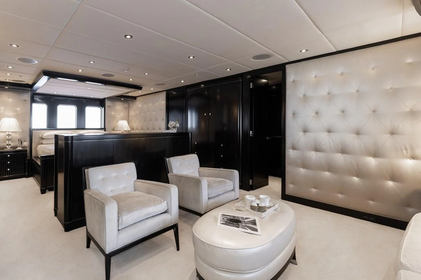 The master stateroom exudes luxury with plush seating, elegant lighting, and sophisticated decor. aboard CARPE DIEM Yacht for Sale