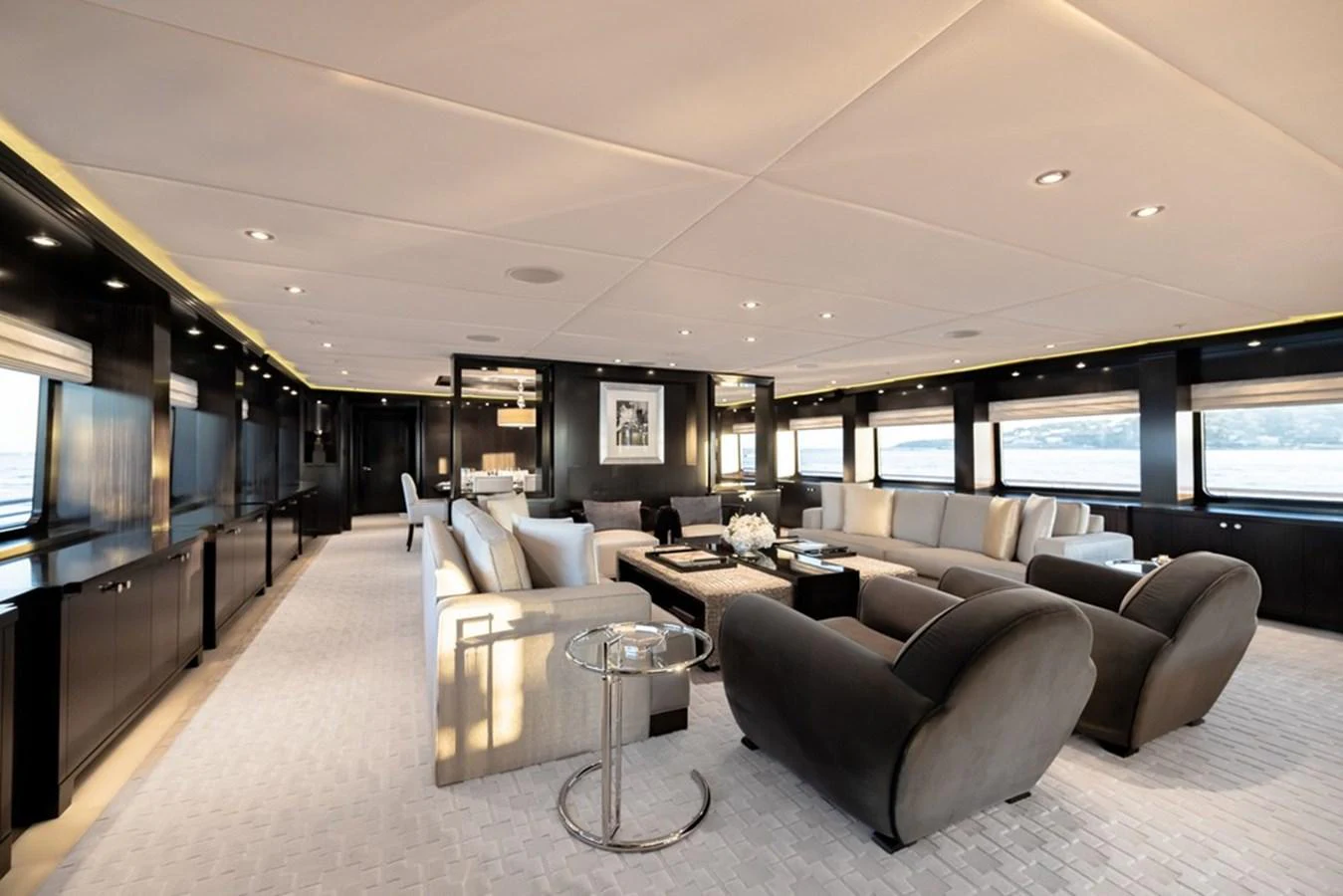 The spacious salon features luxurious seating and elegant decor, perfect for relaxation and socializing. aboard CARPE DIEM Yacht for Sale