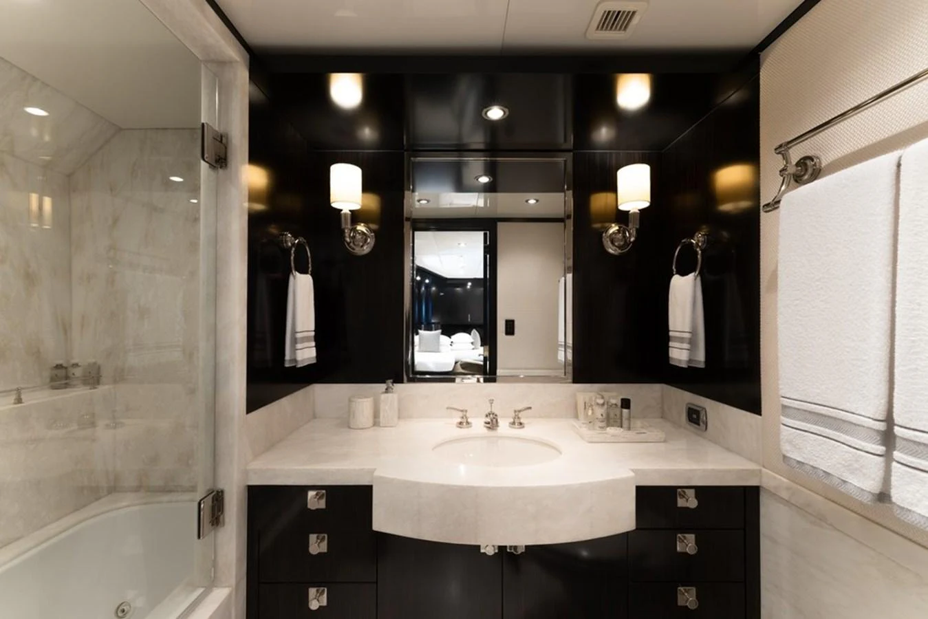 The yacht's bathroom features elegant fixtures and a luxurious marble countertop. aboard CARPE DIEM Yacht for Sale