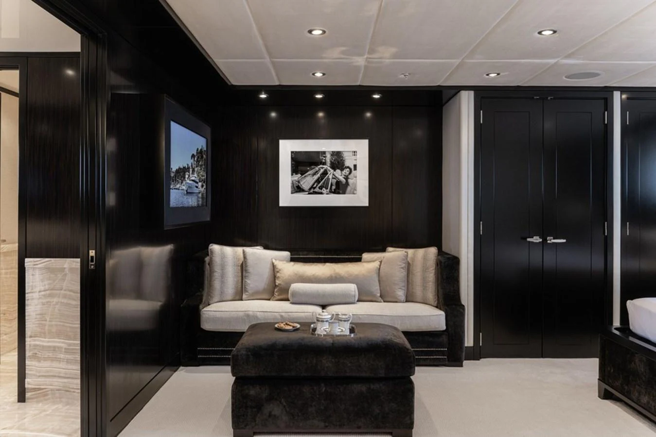The yacht's interior features a luxurious seating area with elegant decor and modern lighting. aboard CARPE DIEM Yacht for Sale