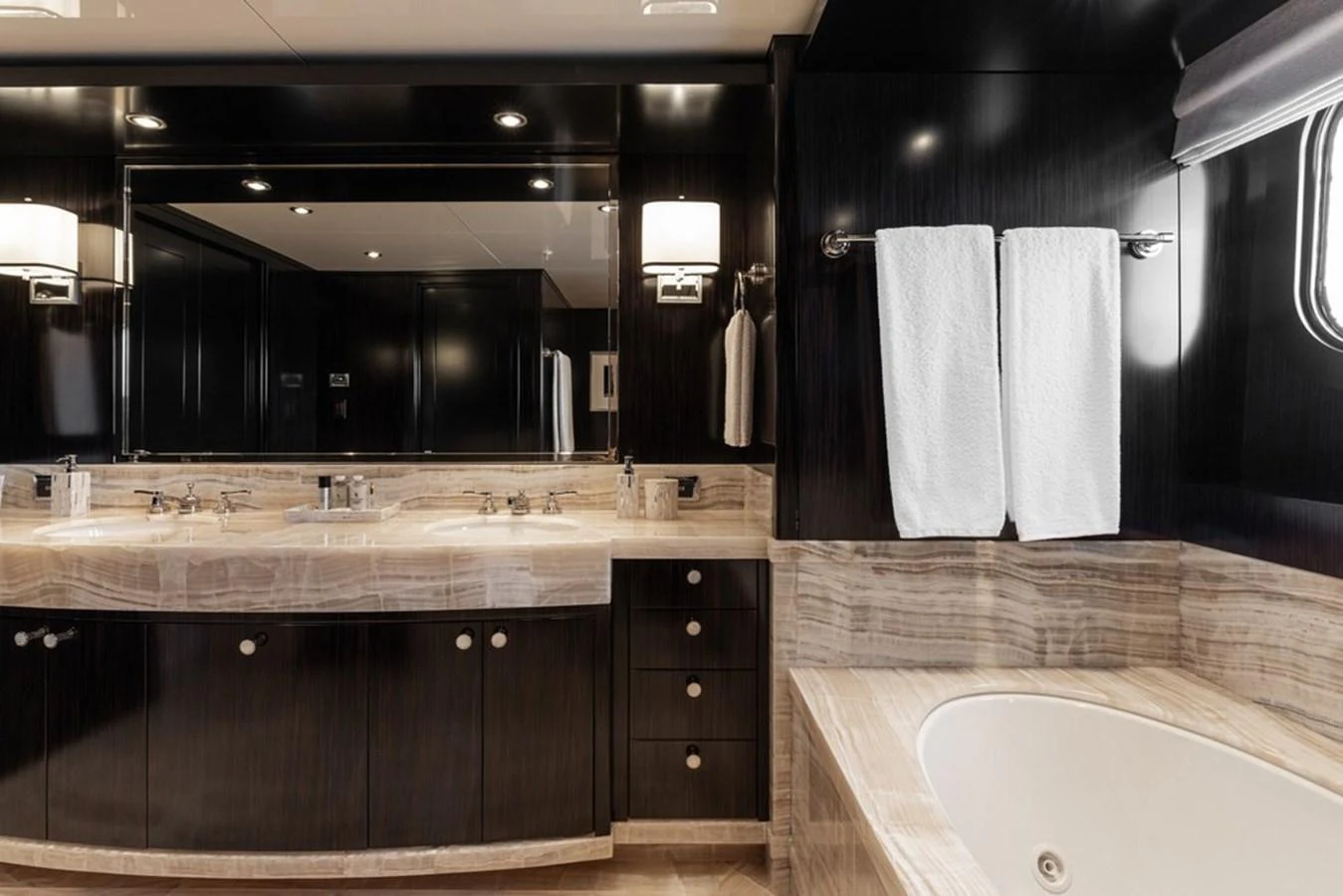 The yacht's bathroom features elegant fixtures and a luxurious bathtub. aboard CARPE DIEM Yacht for Sale