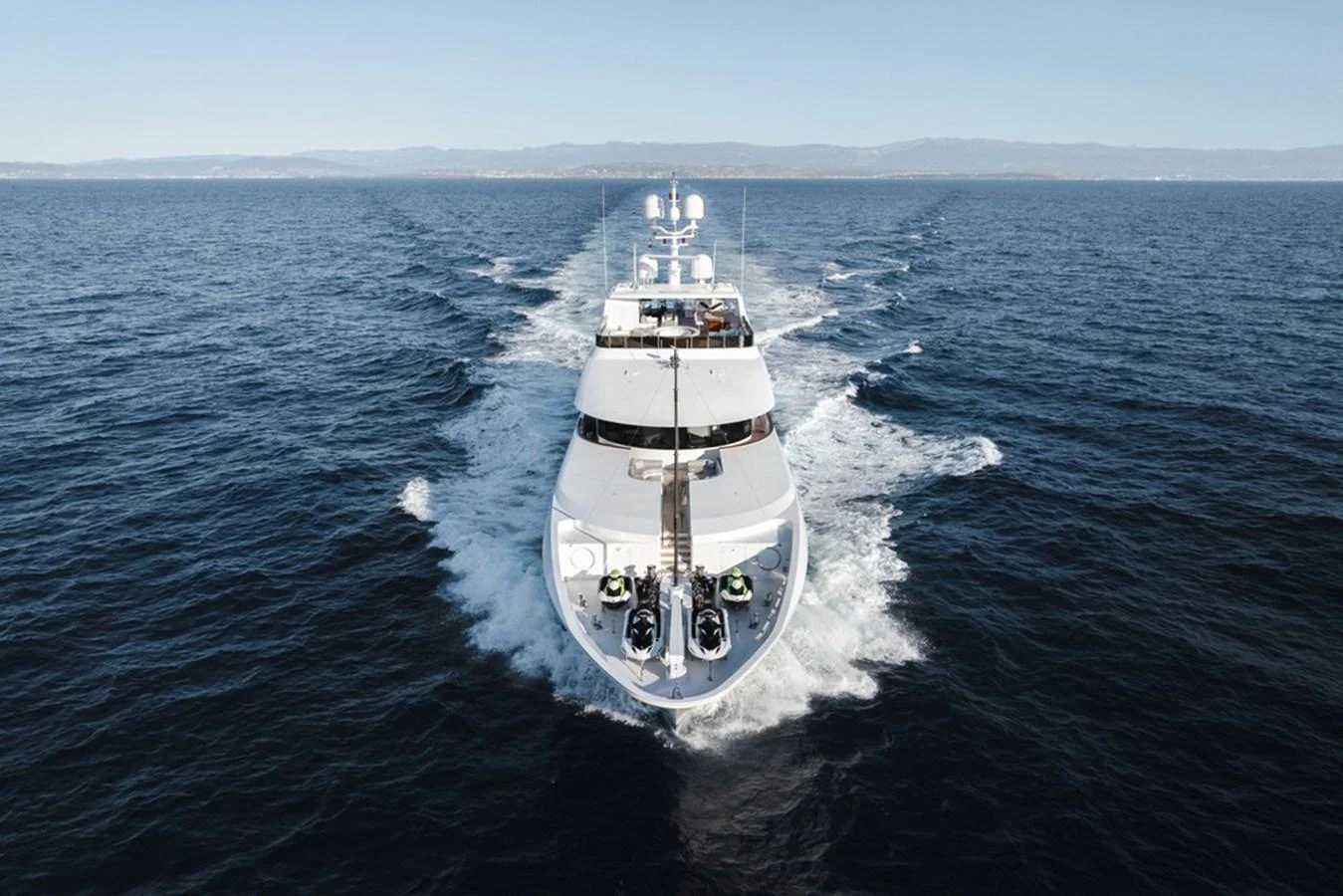 A luxurious yacht cruising through open waters, showcasing its sleek design and powerful performance. aboard CARPE DIEM Yacht for Sale