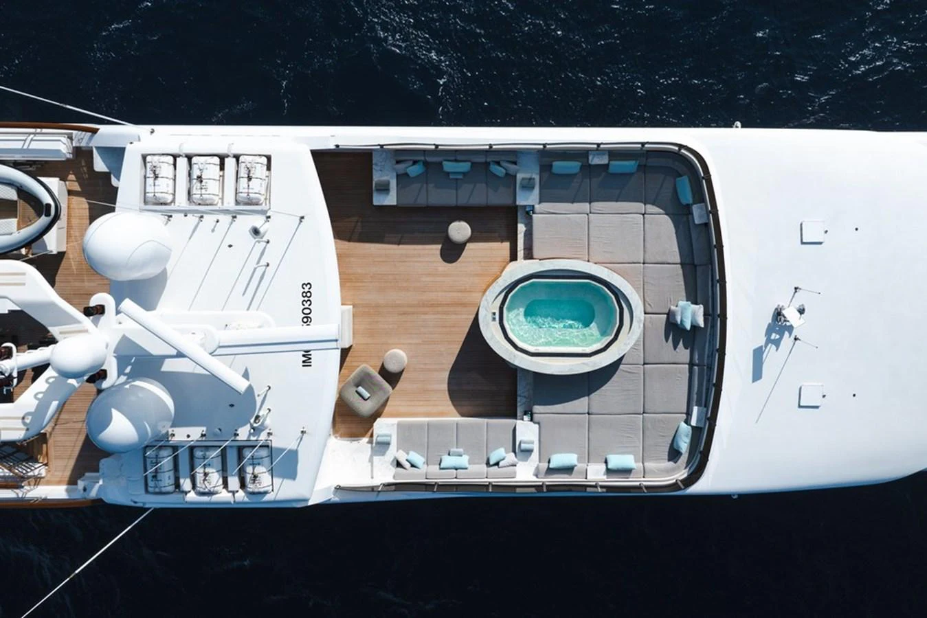 The sundeck features a luxurious hot tub surrounded by ample lounging space, perfect for relaxation. aboard CARPE DIEM Yacht for Sale