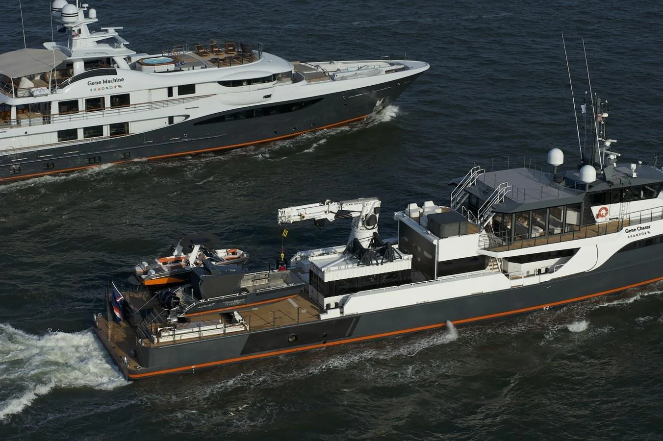Two yachts are cruising on the water, showcasing their sleek designs and luxurious features. aboard GENE CHASER Yacht for Sale