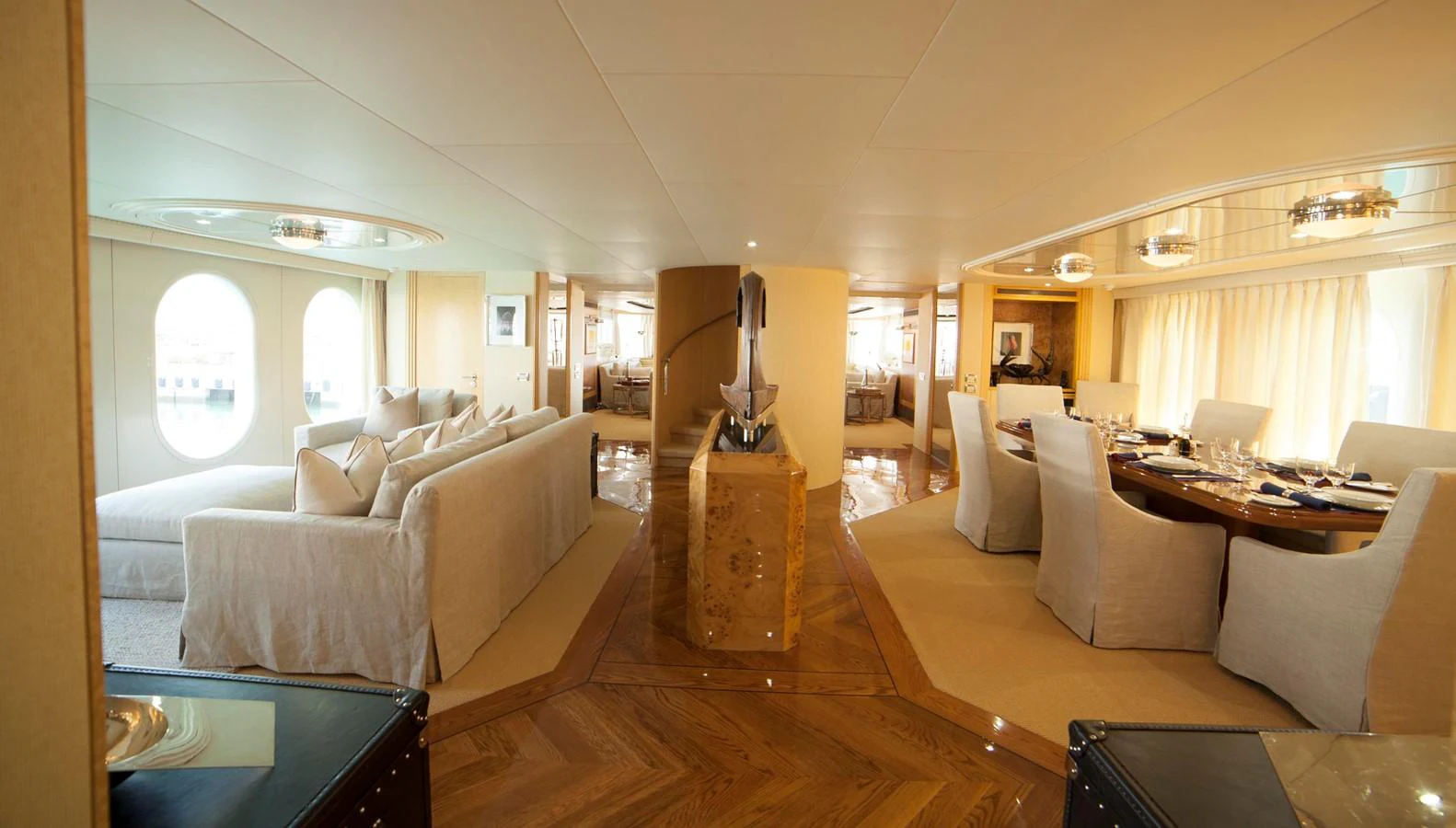 The spacious salon features elegant seating and a formal dining area with luxurious finishes. aboard OCEANA I Yacht for Sale