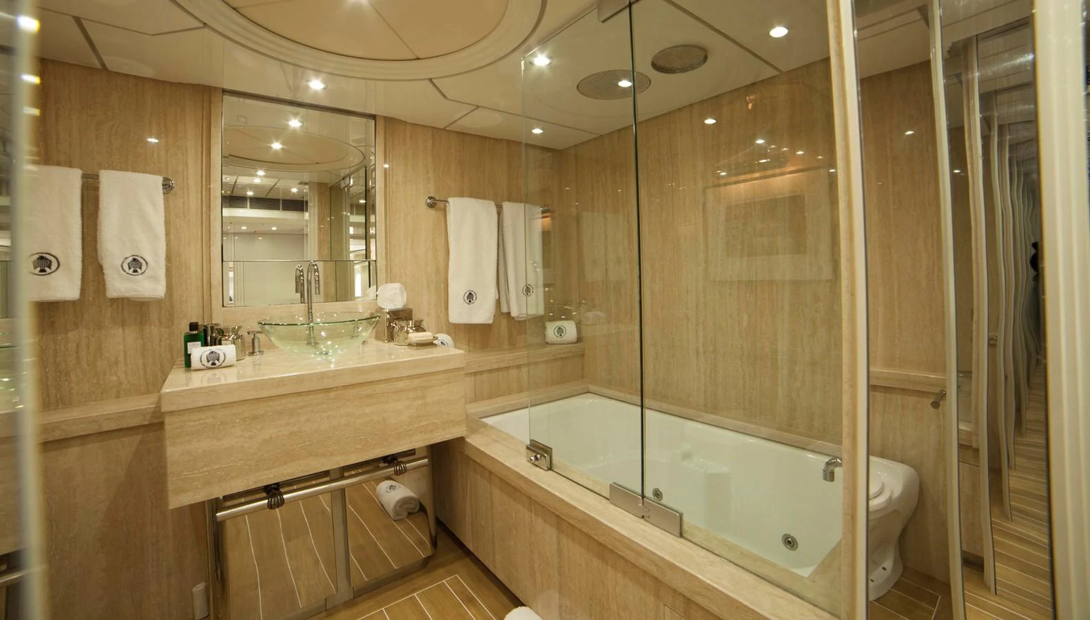 The yacht's bathroom features elegant fixtures and a luxurious bathtub. aboard OCEANA I Yacht for Sale