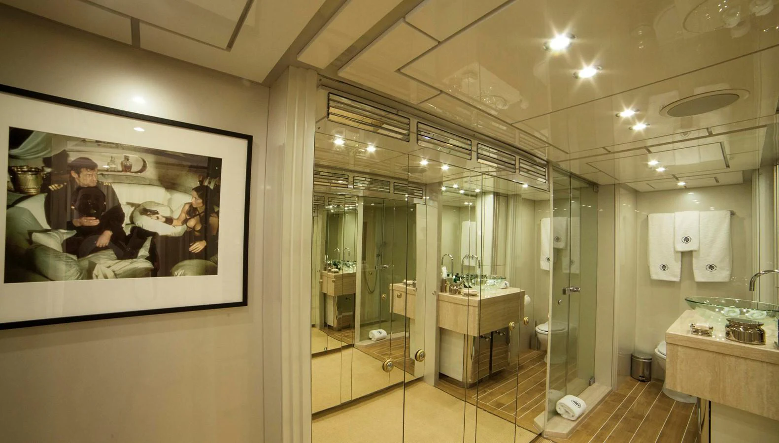 The yacht's bathroom features elegant fixtures and a spacious, mirrored design. aboard OCEANA I Yacht for Sale